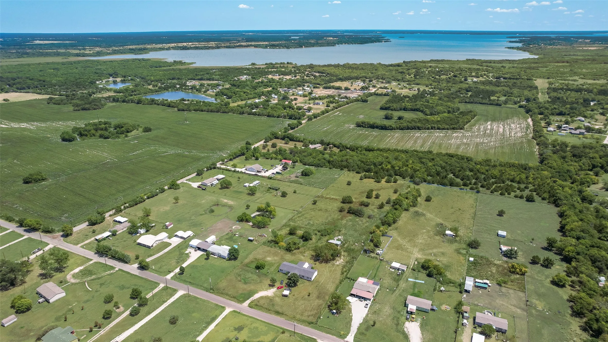 Expansive green acreage with diverse tree coverage