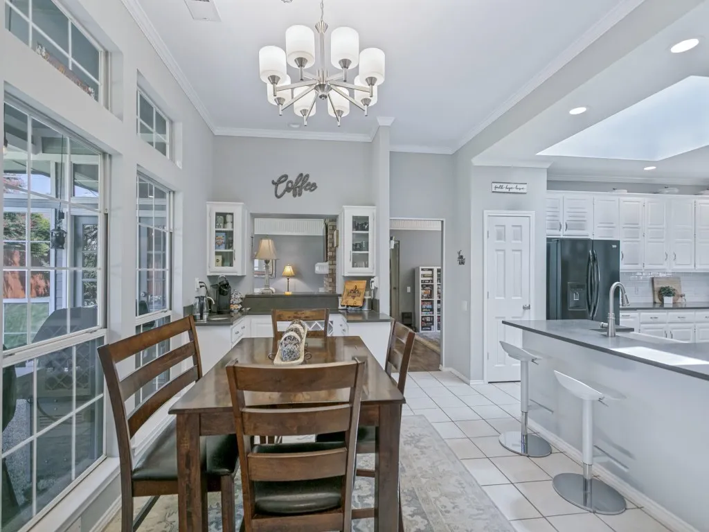 The breakfast area provides a comfortable place to enjoy dinner with views throughout the house and patio.