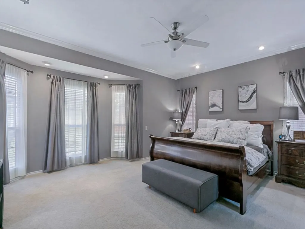 Private and spacious primary suite has a bayed window perfect for desk or sitting area.