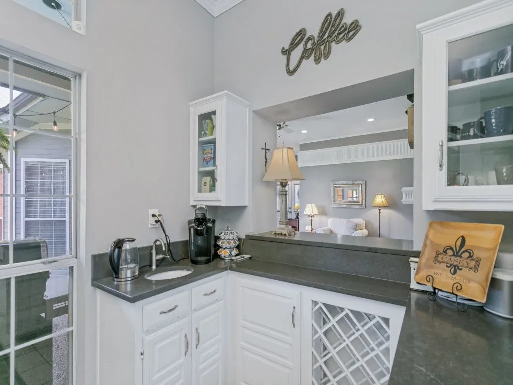 Functional butler's pantry with second sink, wine racks and more storage for wine or coffee.