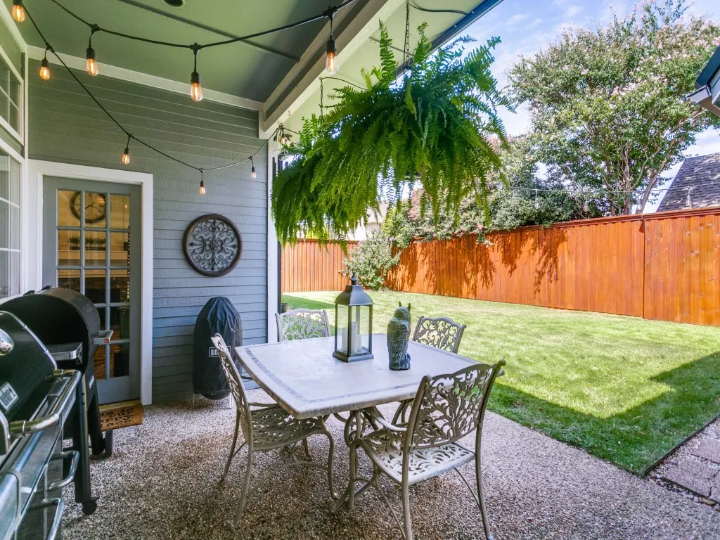 The patio and windows throughout the house provide great views of this private backyard with 8' board on board fence.