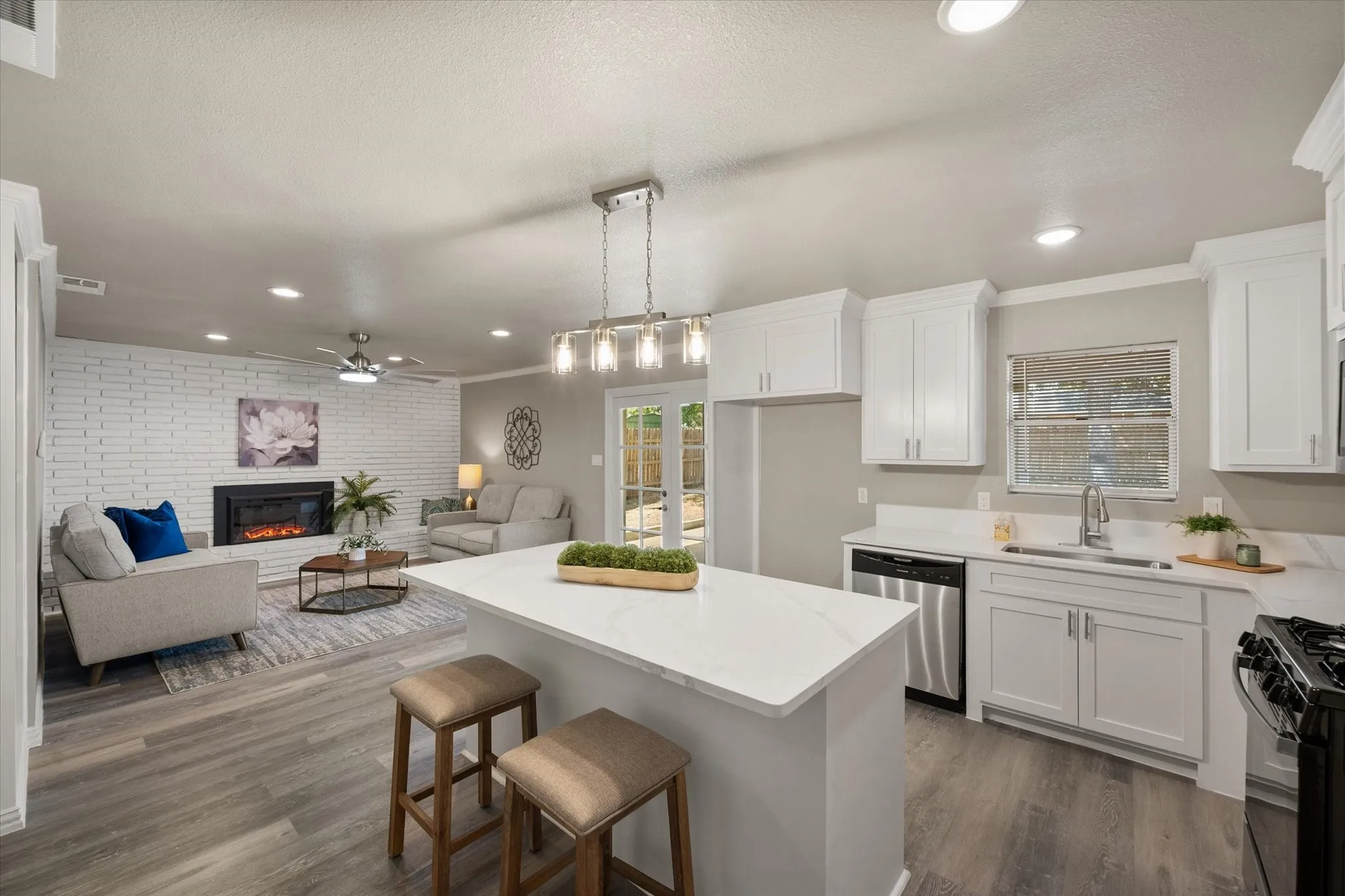 Open concept living at it's best - Large island with quartz countertops, new appliances, new cabinets, new lighting.