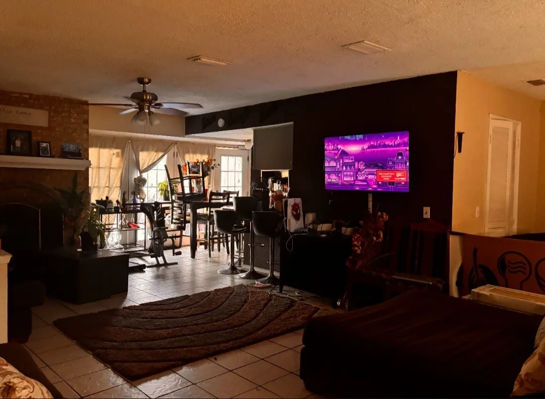Tiled flooring and a ceiling fan with integrated lighting