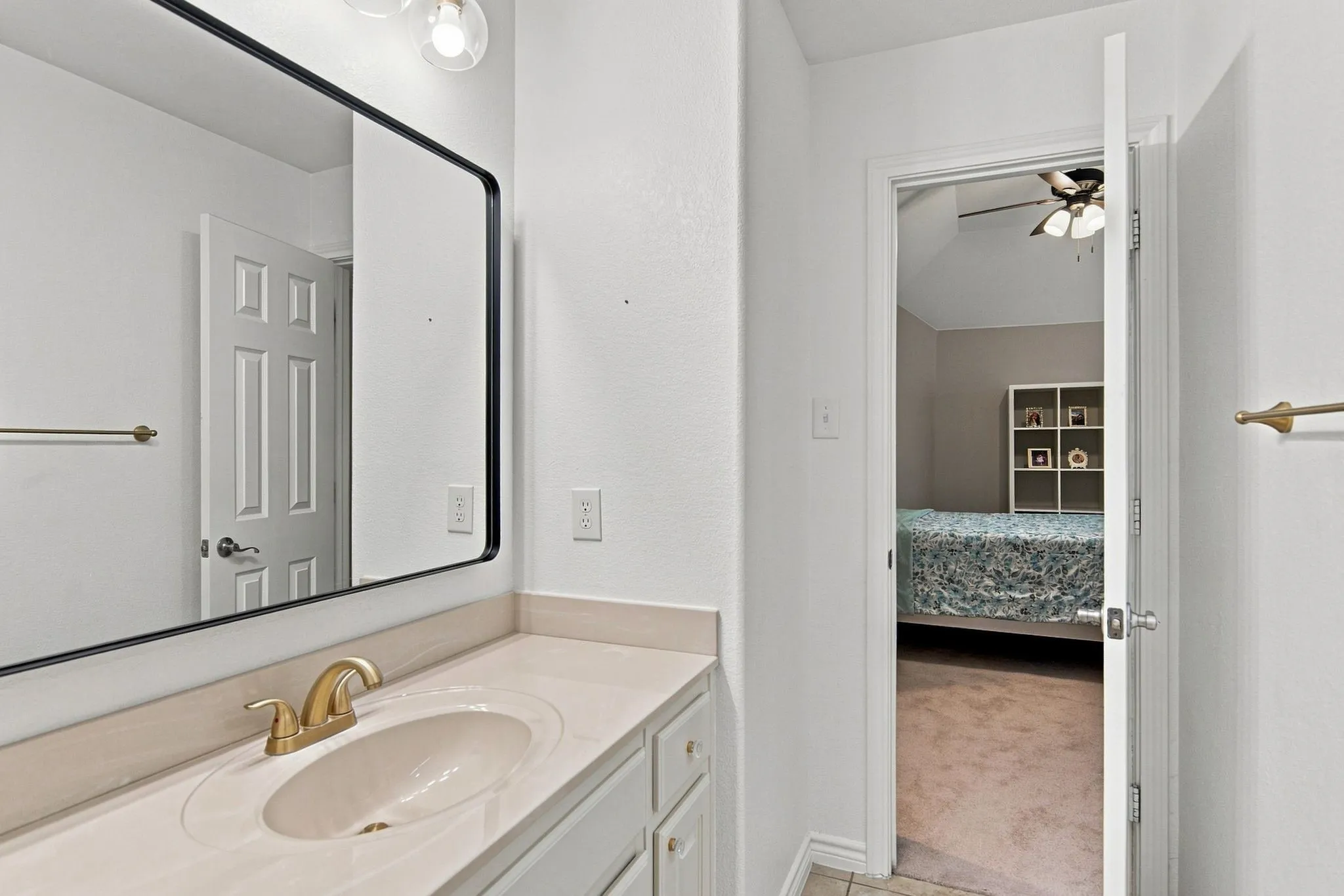Integrated vanity with an undermount sink and gold-finish faucet