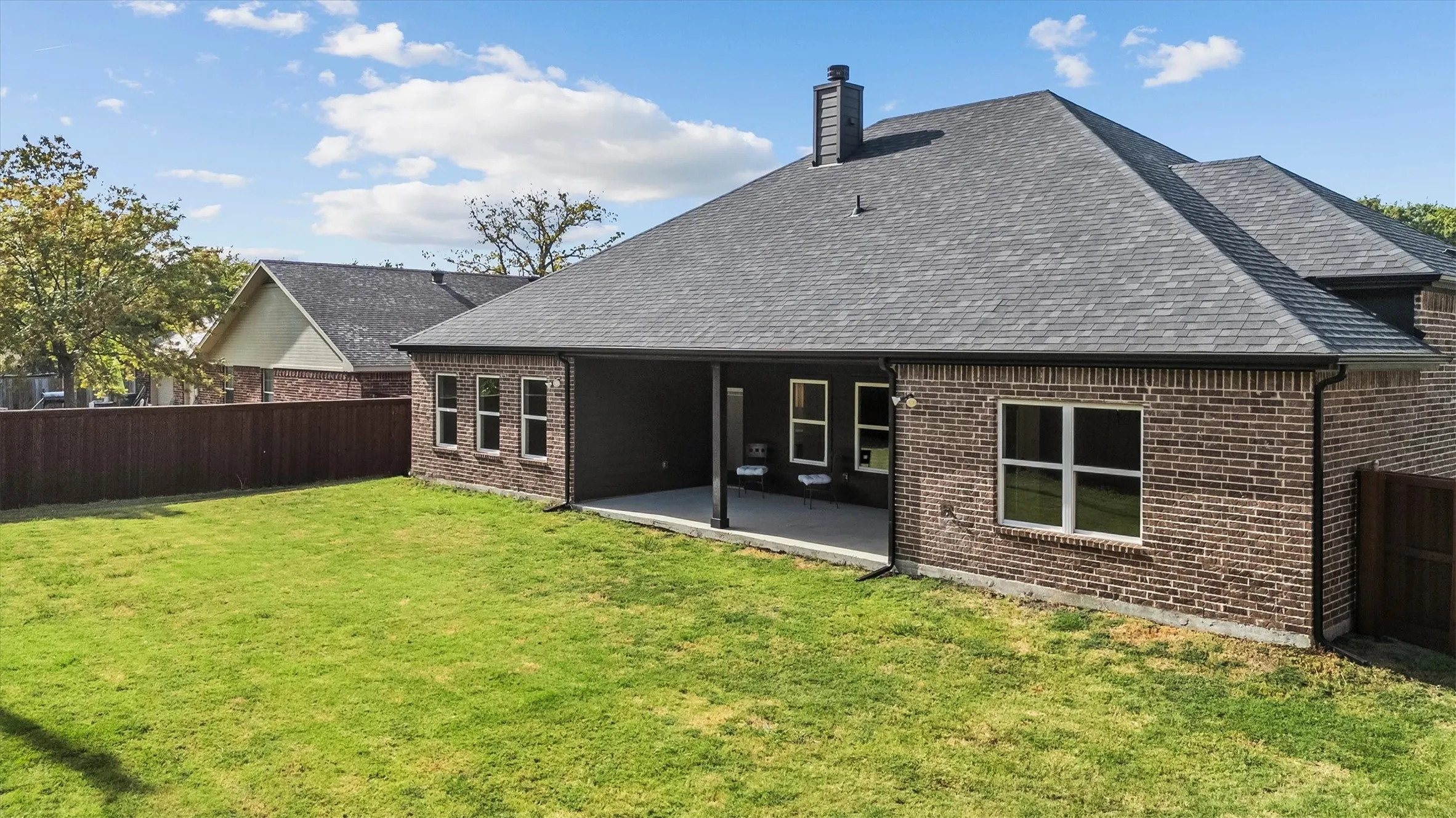 Large yard with tall privacy fence