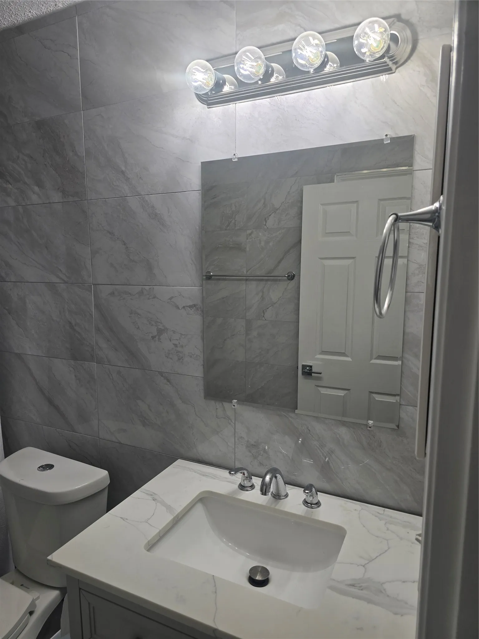 Modern vanity with an integrated sink and chrome fixtures