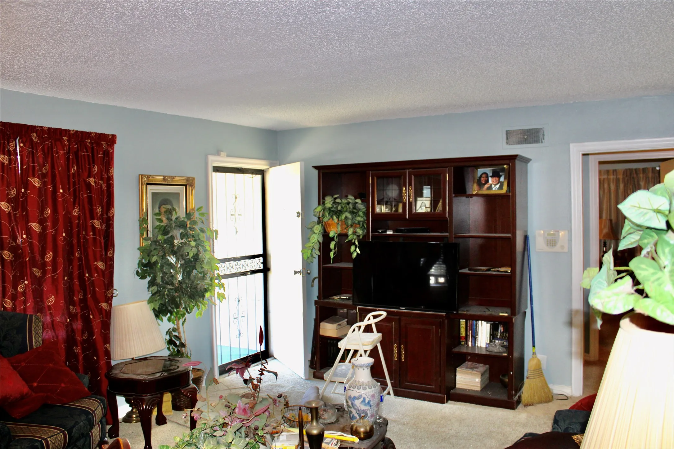 Light blue wall paint and carpeted flooring