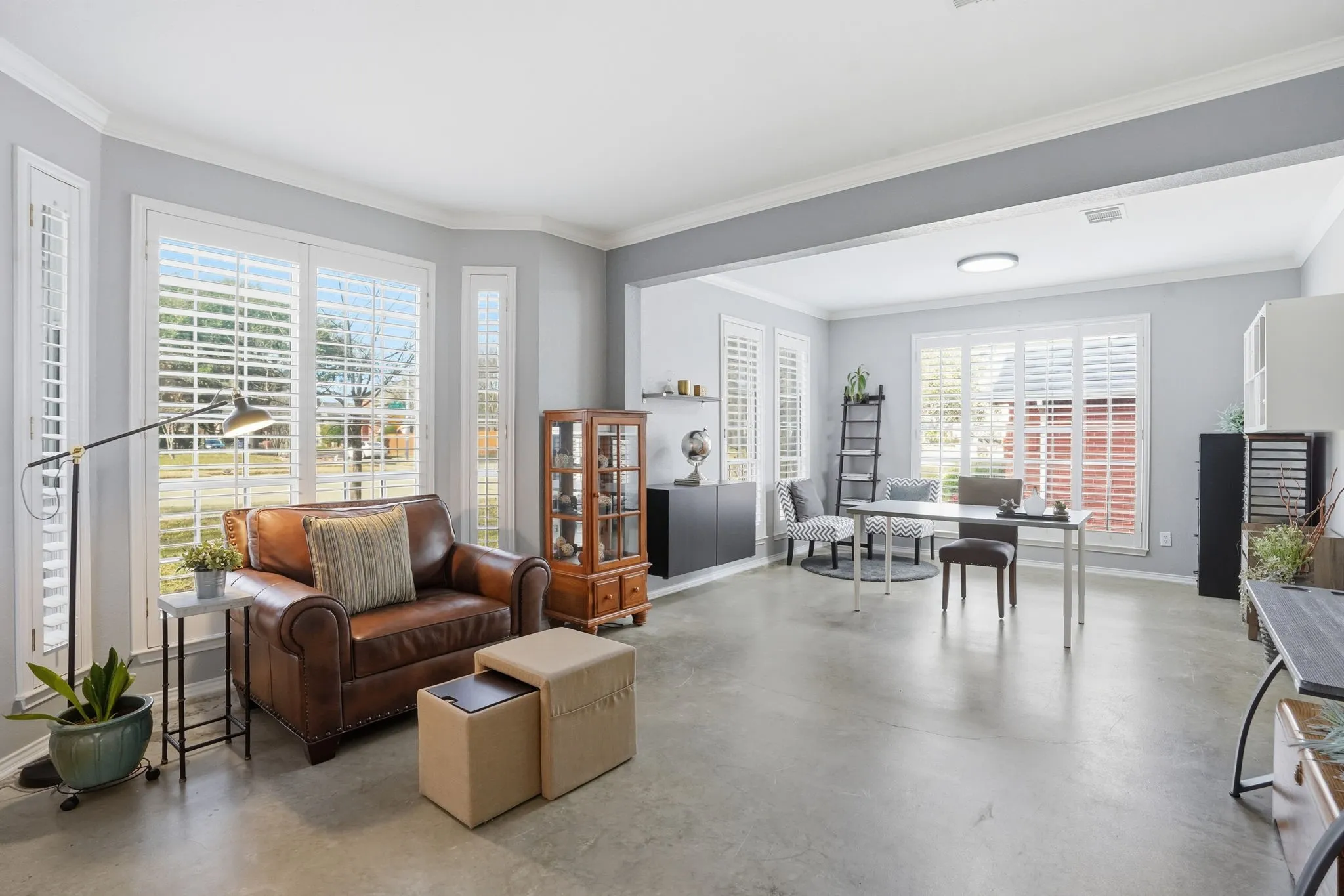 On the left is a spacious combined living and dining area, perfect for a playroom, homeschool space, home office, or whatever best fits your needs.