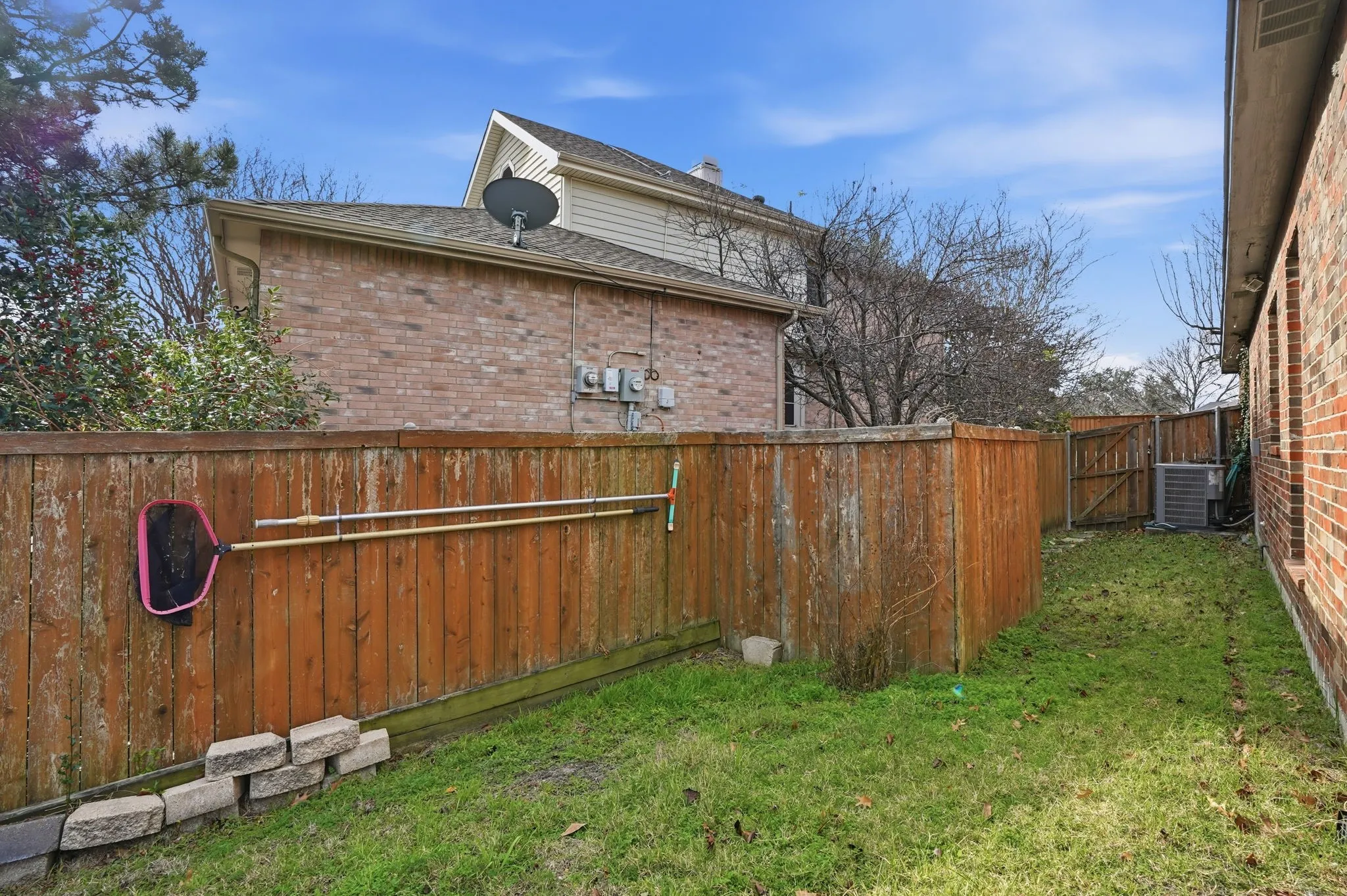 Fenced side yard grass area