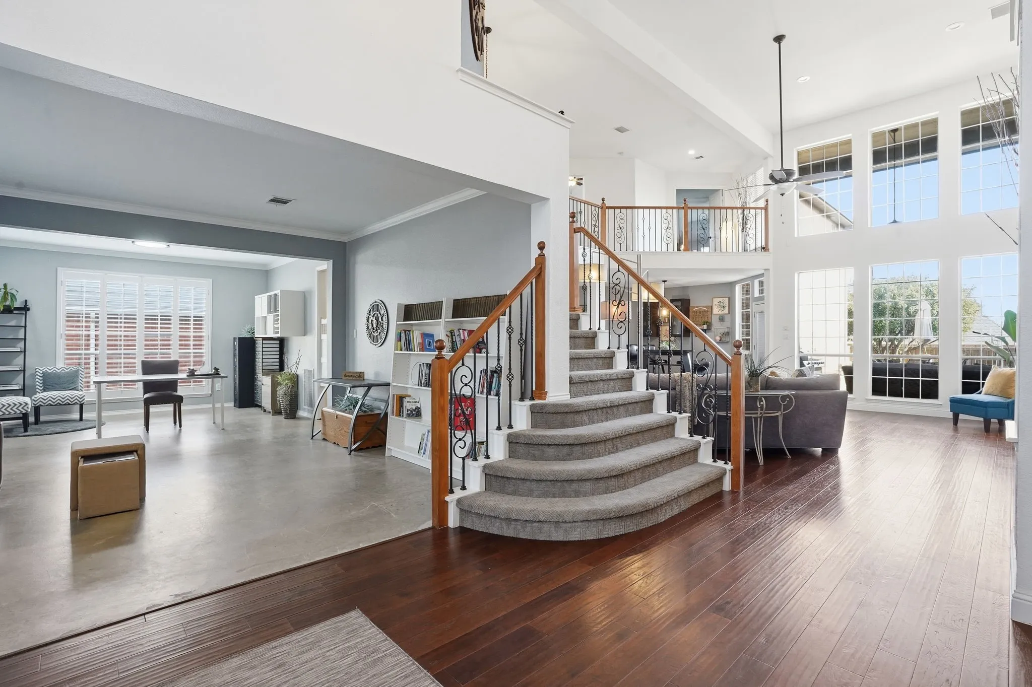 Step inside to a beautifully designed winding staircase in this open, bright, and inviting home.