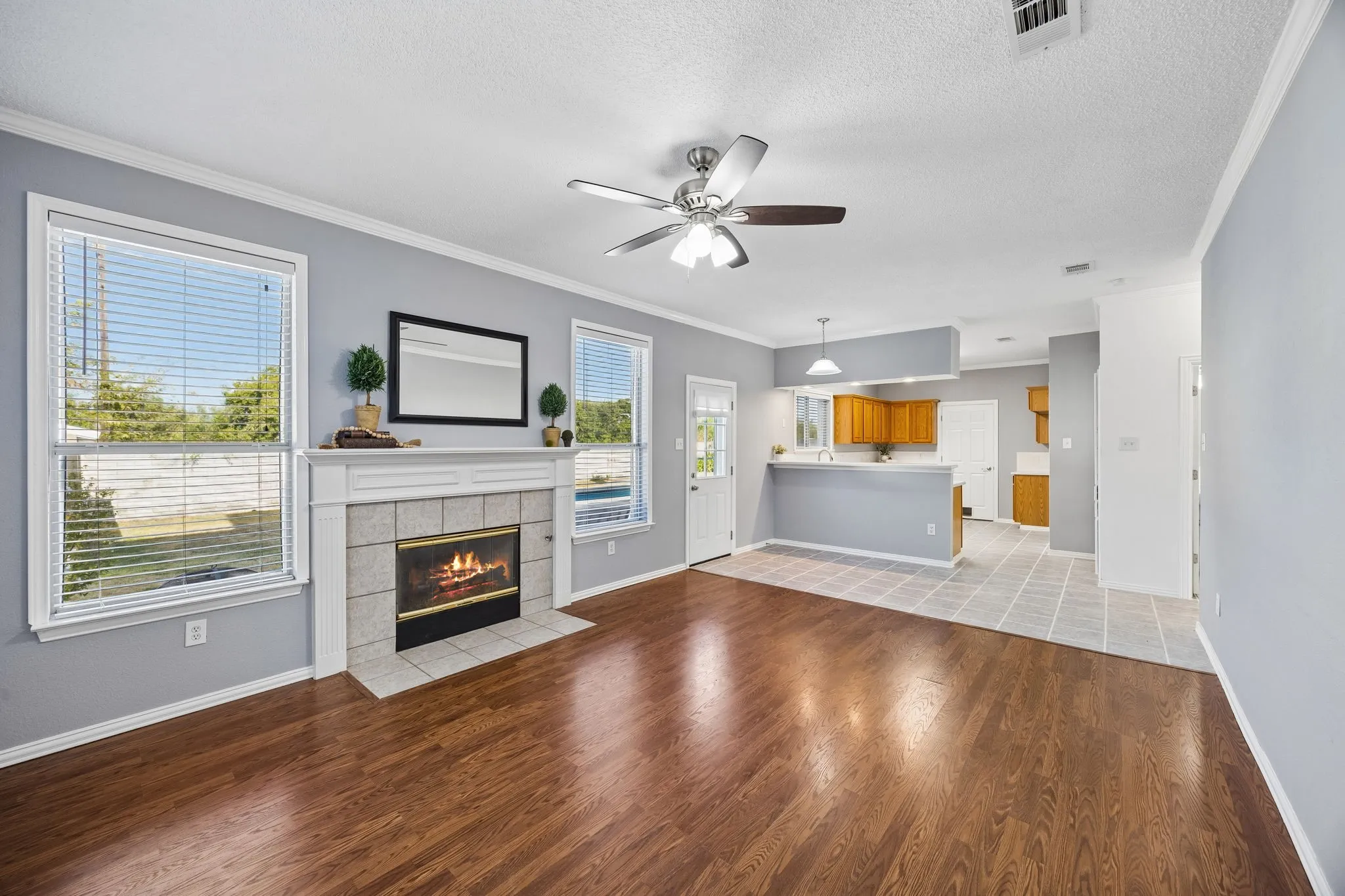 One of three living areas, this one overlooks the backyard and is open to the kitchen.