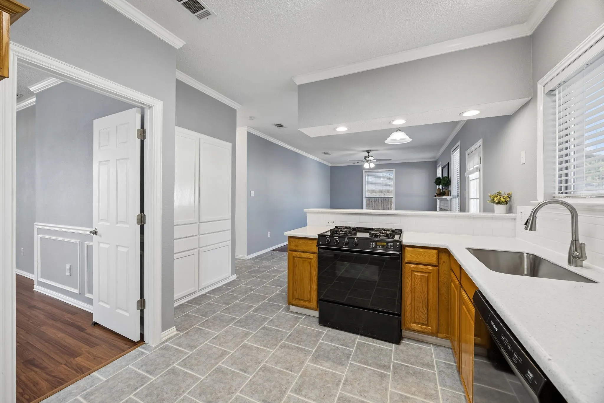 Kitchen with breakfast bar overlooking the family room and access to dining and living room makes this a great space to entertain.