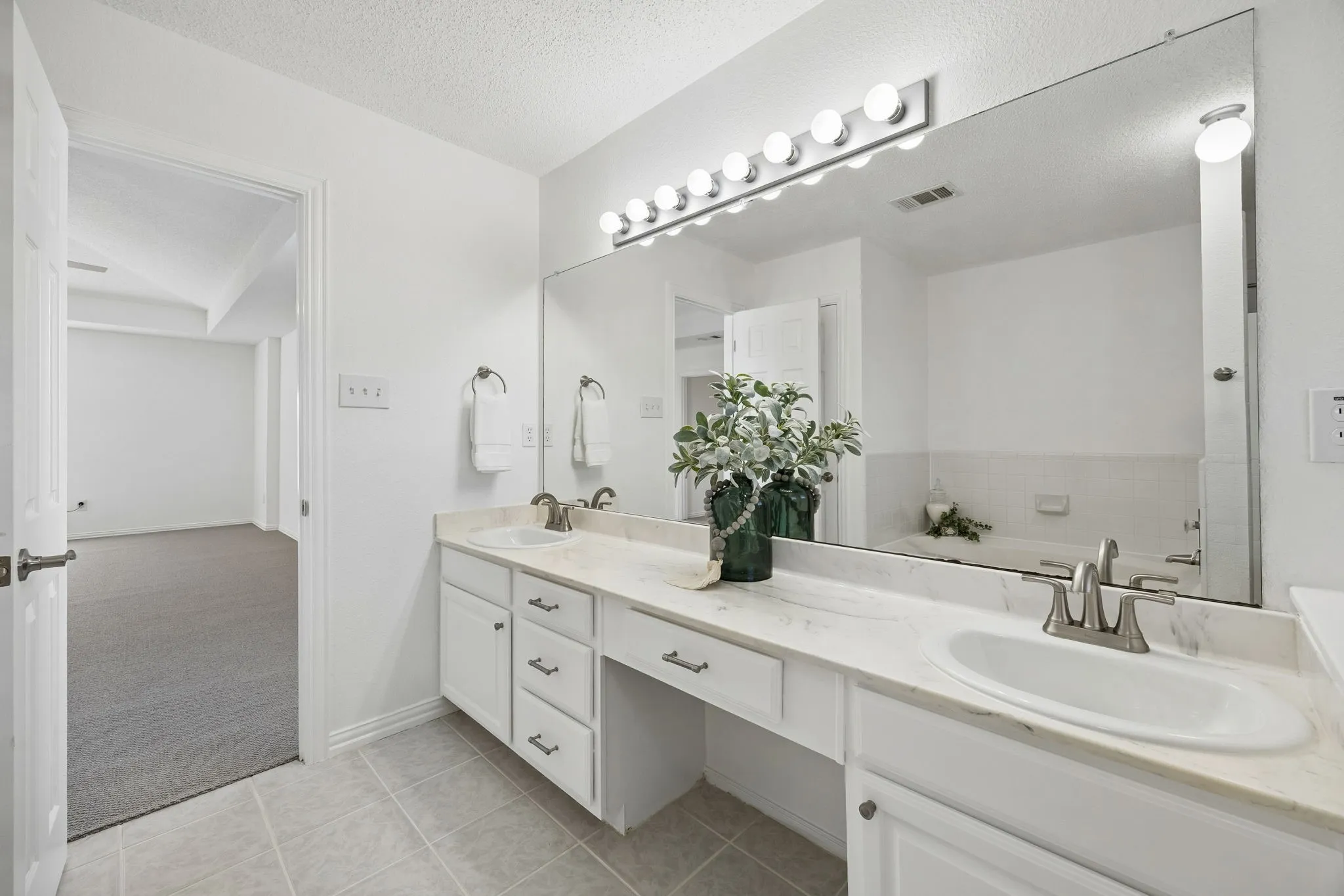 Dual sinks, update fixtures, new shower door.