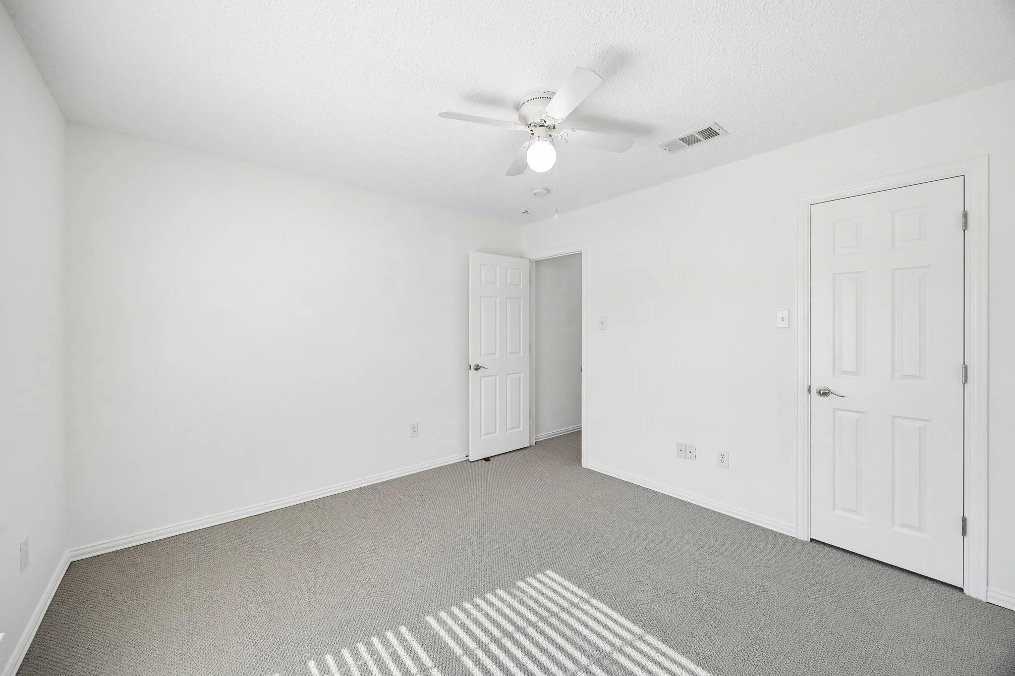 Secondary bedroom with walk-in closet