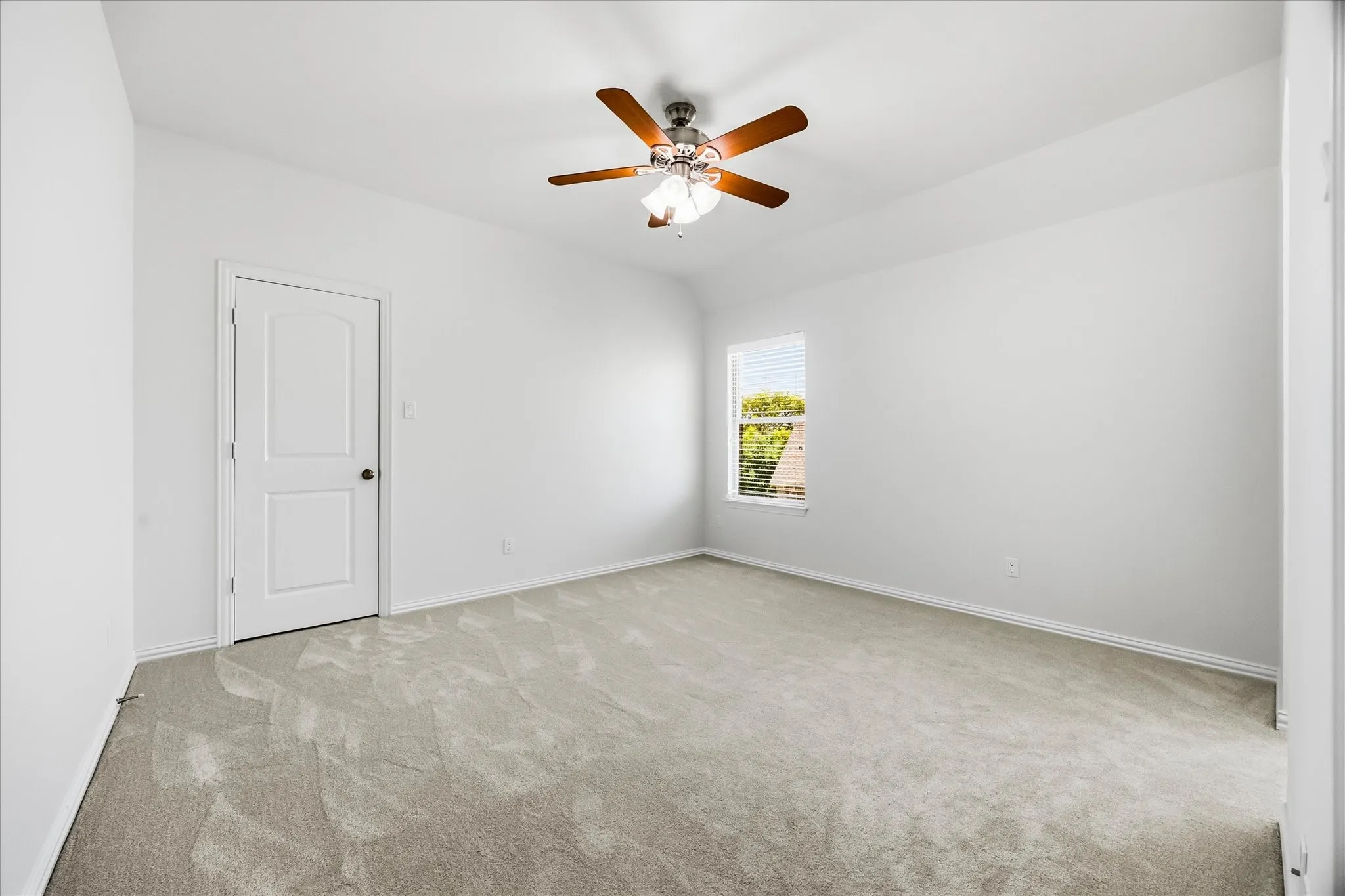 Bedroom 3 has a ceiling fan and large walk-in closet with walk-in attic access.