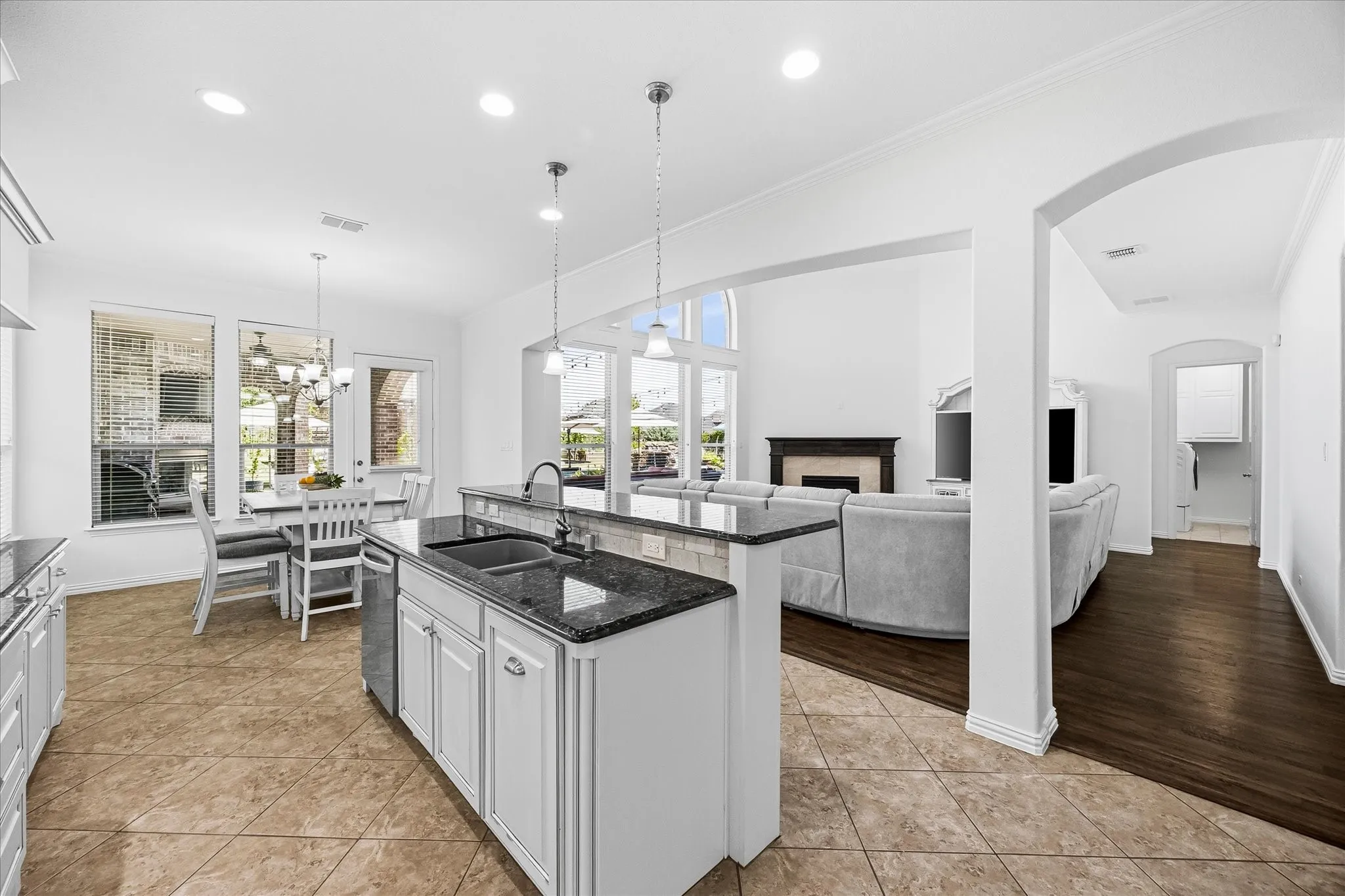 The island kitchen is open to the living room and breakfast nook, keeping everyone connected.