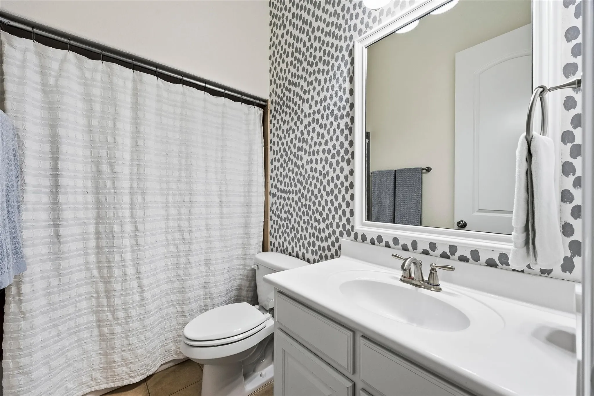 It also has its own private full bathroom with coordinating accent paint.