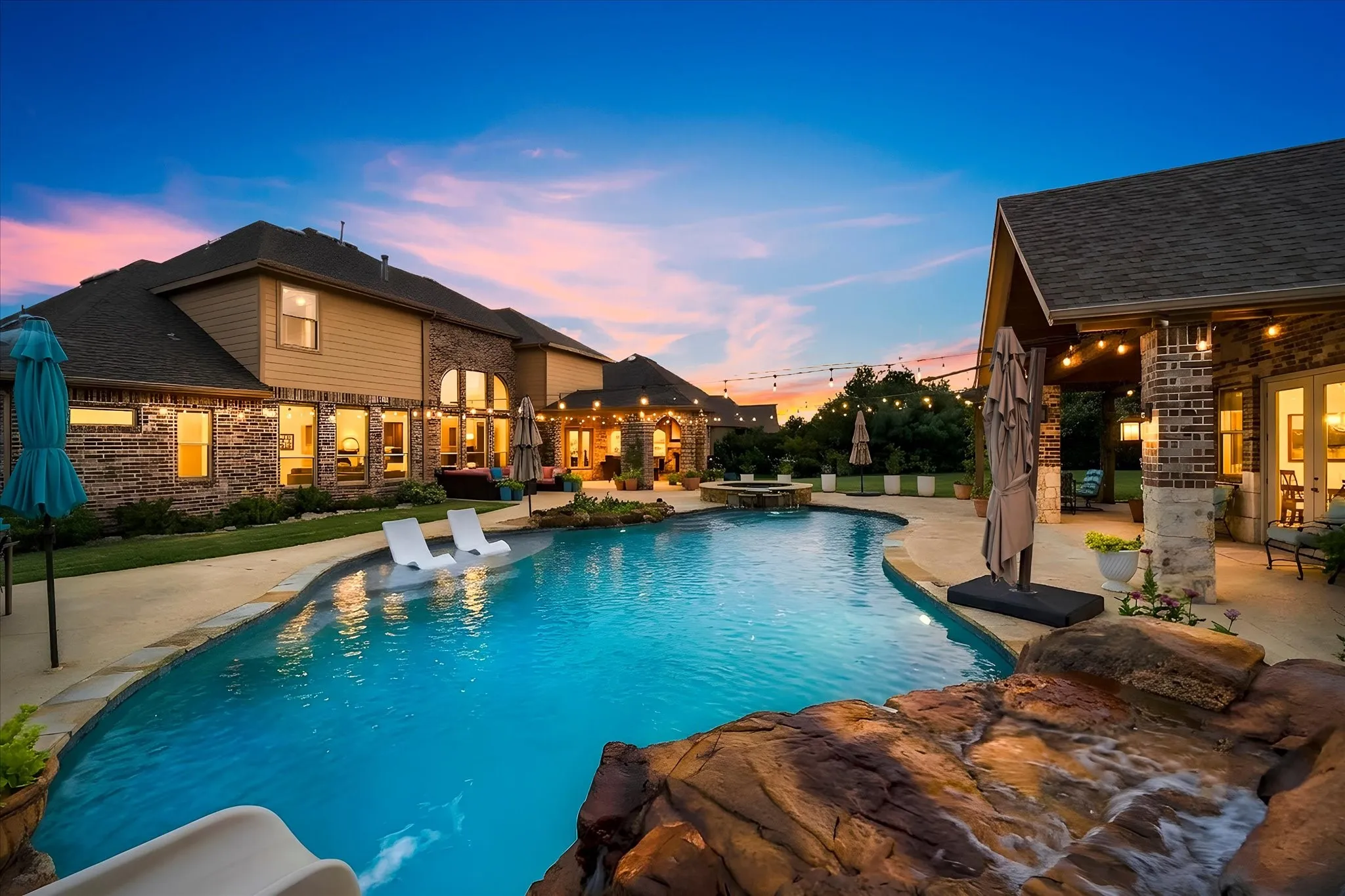 The resort-style backyard is perfect for relaxation or entertaining.