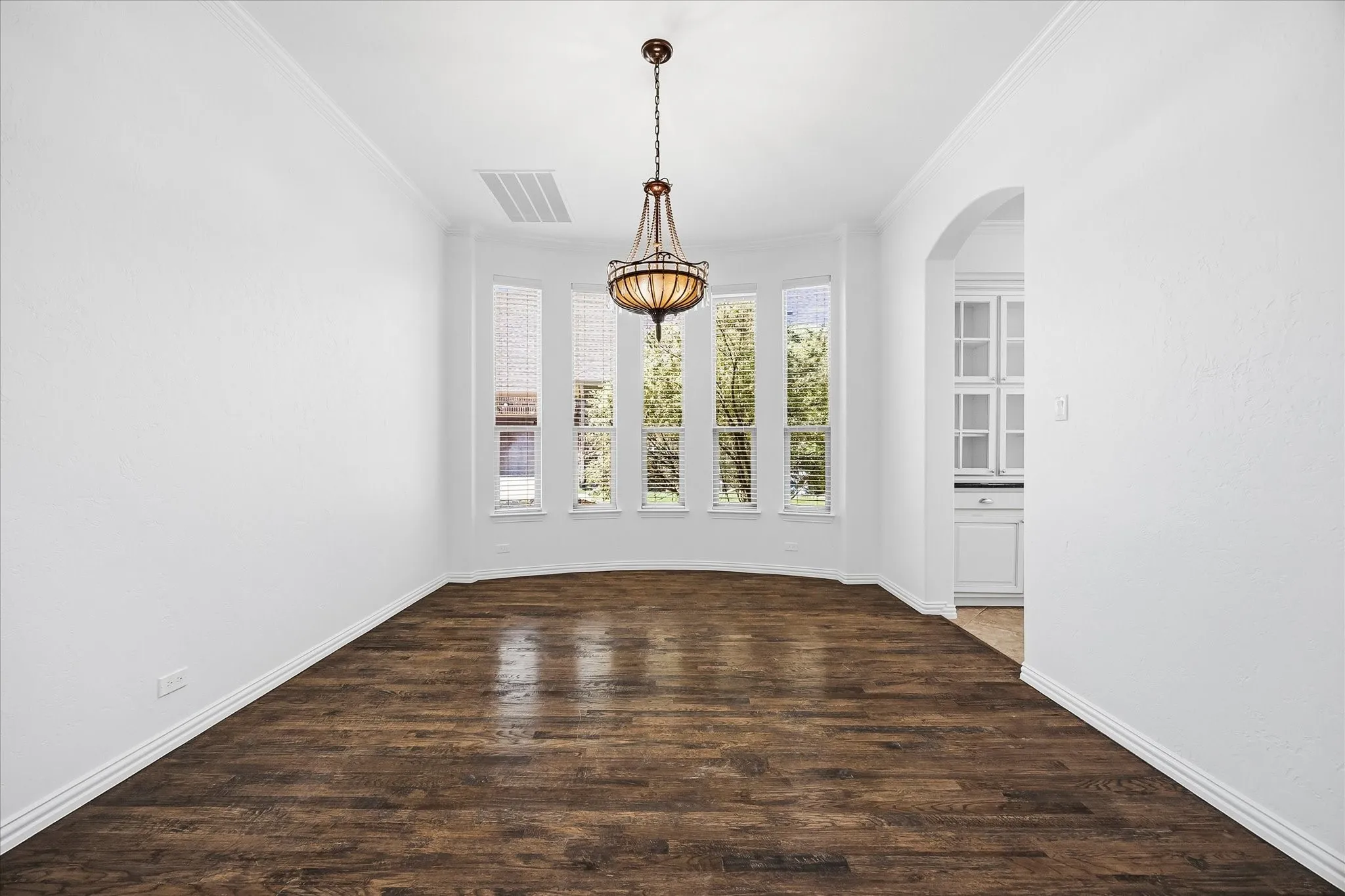 The elegant formal dining room is perfect for hosting dinner parties or game night.