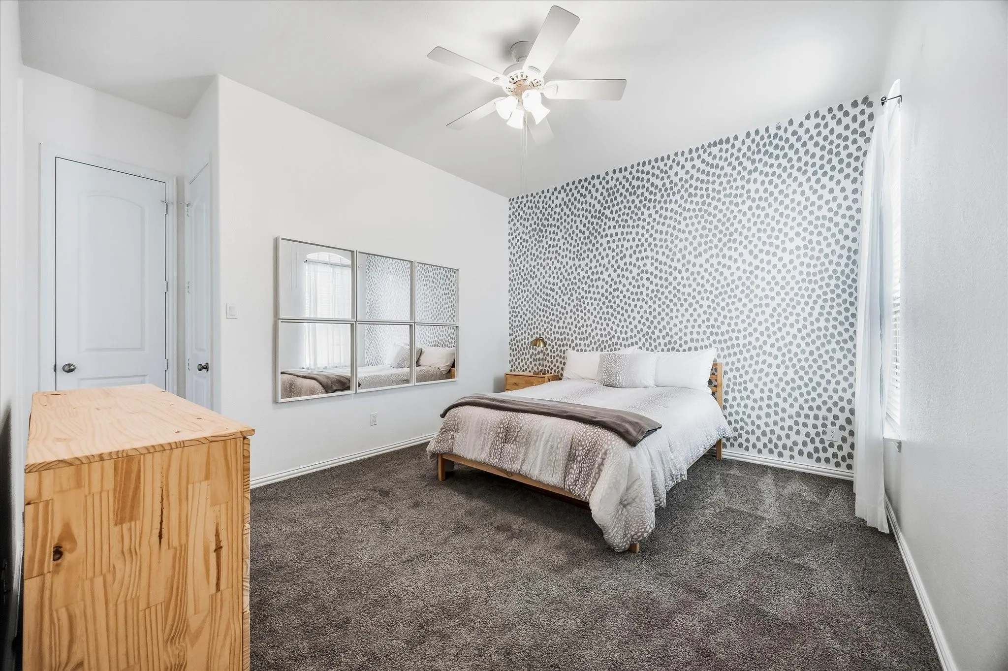 The guest suite is generously sized and includes linen and walk-in closets.