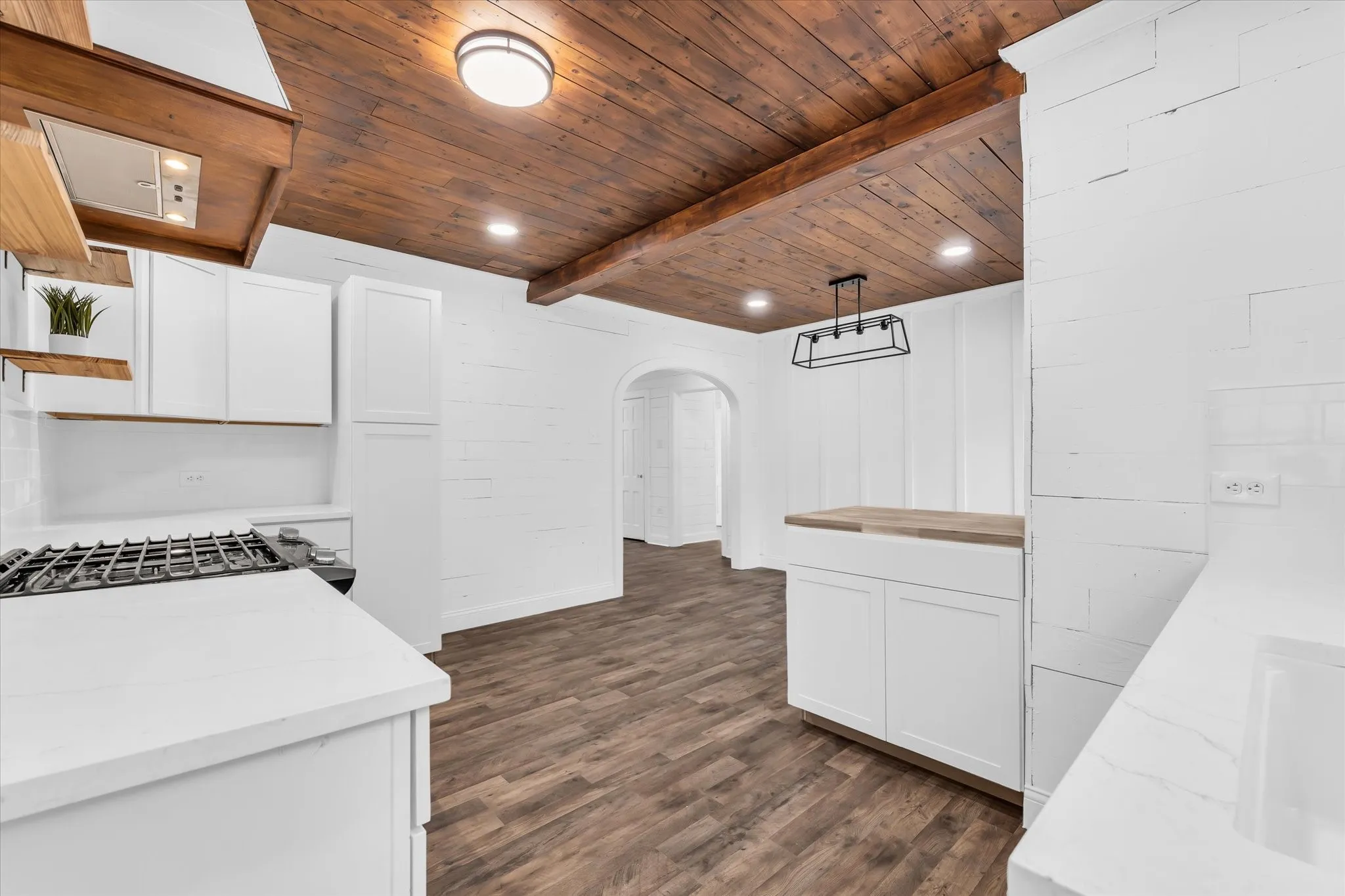 Wood-finish plank ceiling with recessed lighting