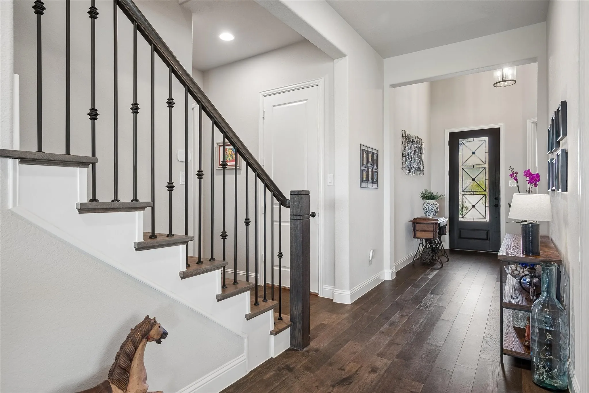 Outdoor living shines with serene greenbelt views and magnificent sunsets from the covered flagstone porch and two additional open patio areas ideal for entertaining. (Grass greened using AI)