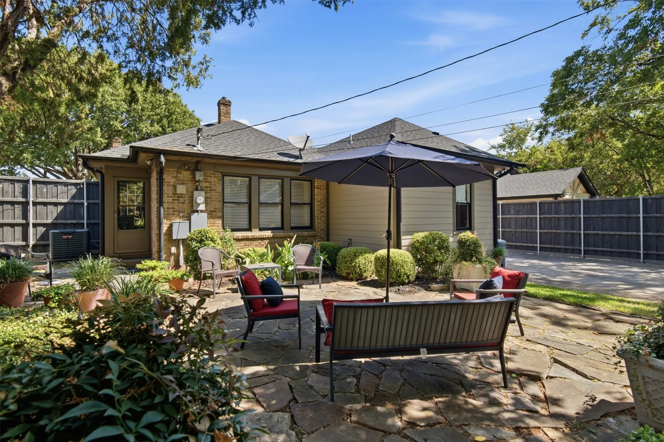 Shaded backyard to enjoy cool alfresco dining and entertaining.