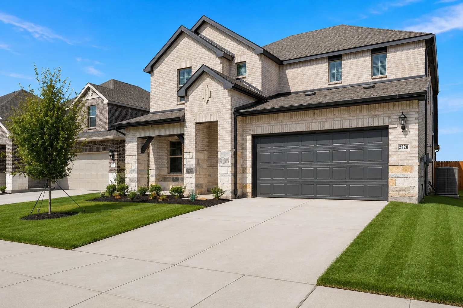 Light-toned brick exterior with dark trim accents