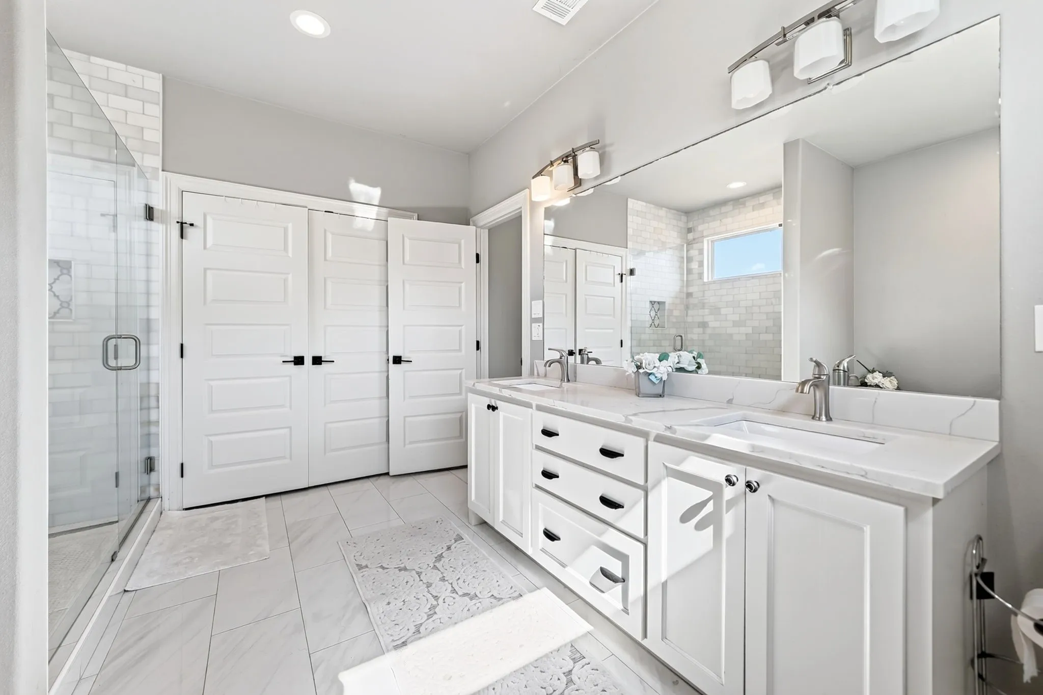 Dual vanity with undermount sinks and white countertops