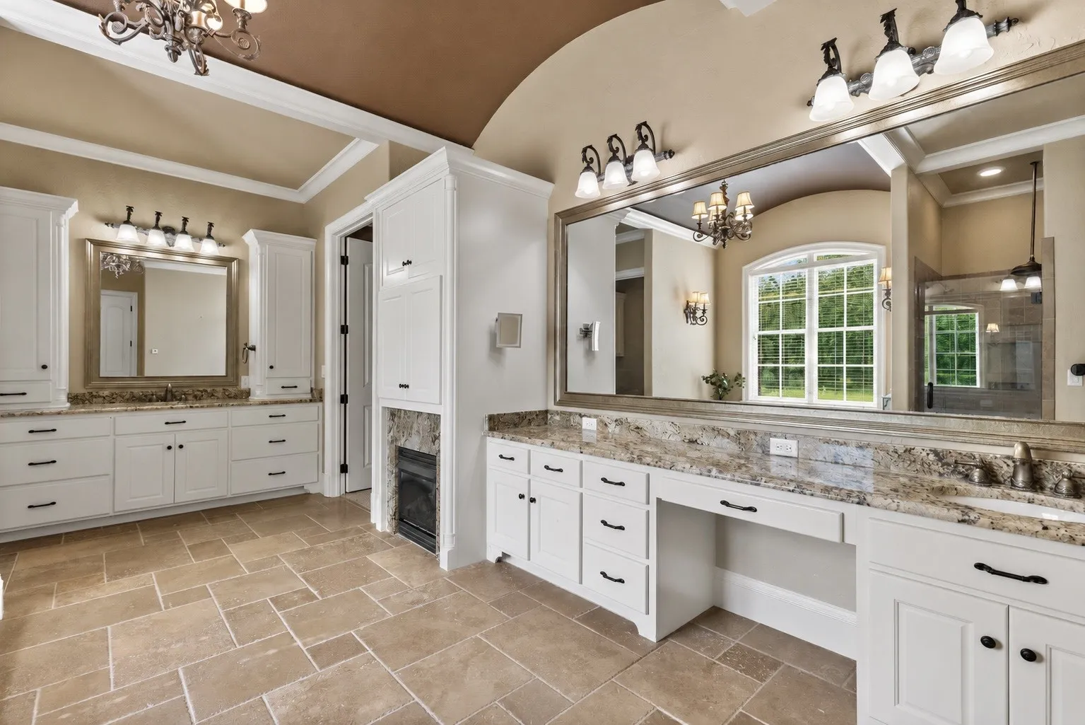 Private Primary Suite Retreat featuring a jetted tub, large walk-in tiled shower, dual vanities, spacious walk-in closet with built-ins, abundant storage, custom cabinetry, and a stunning circular domed ceiling accent.
