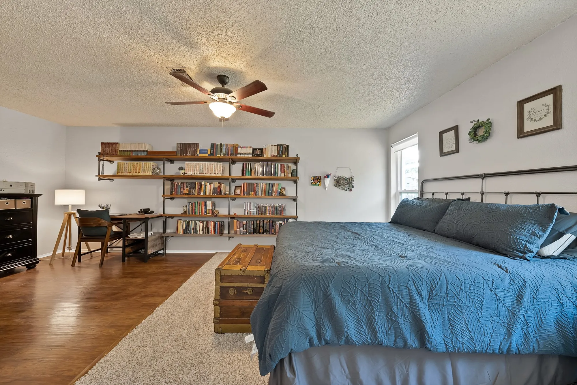 Wood-finish flooring with a contrasting area rug