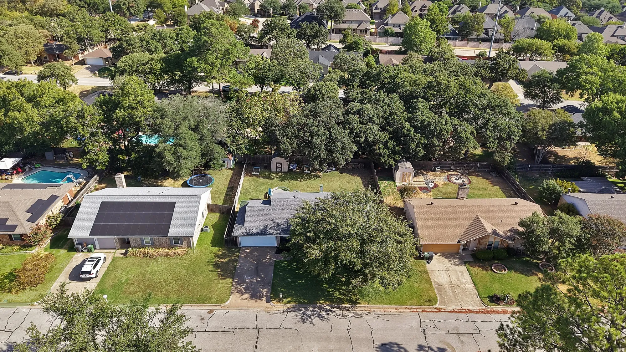 Expansive residential area featuring numerous mature trees and well-maintained lawns