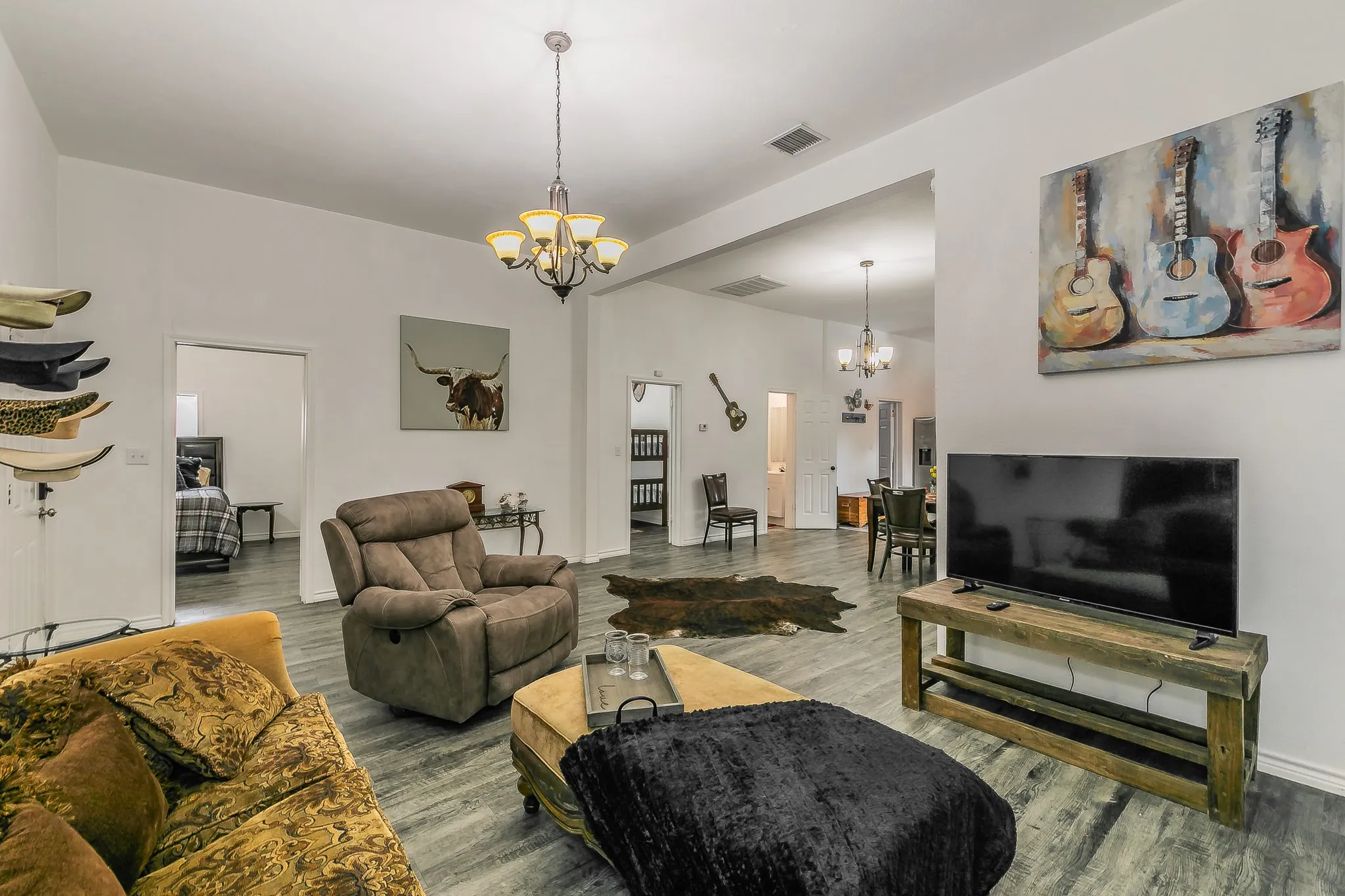 Spacious interior with wood-finish flooring and white walls