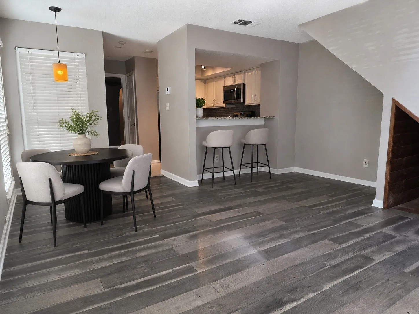 Dining space open to living and kitchen breakfast bar