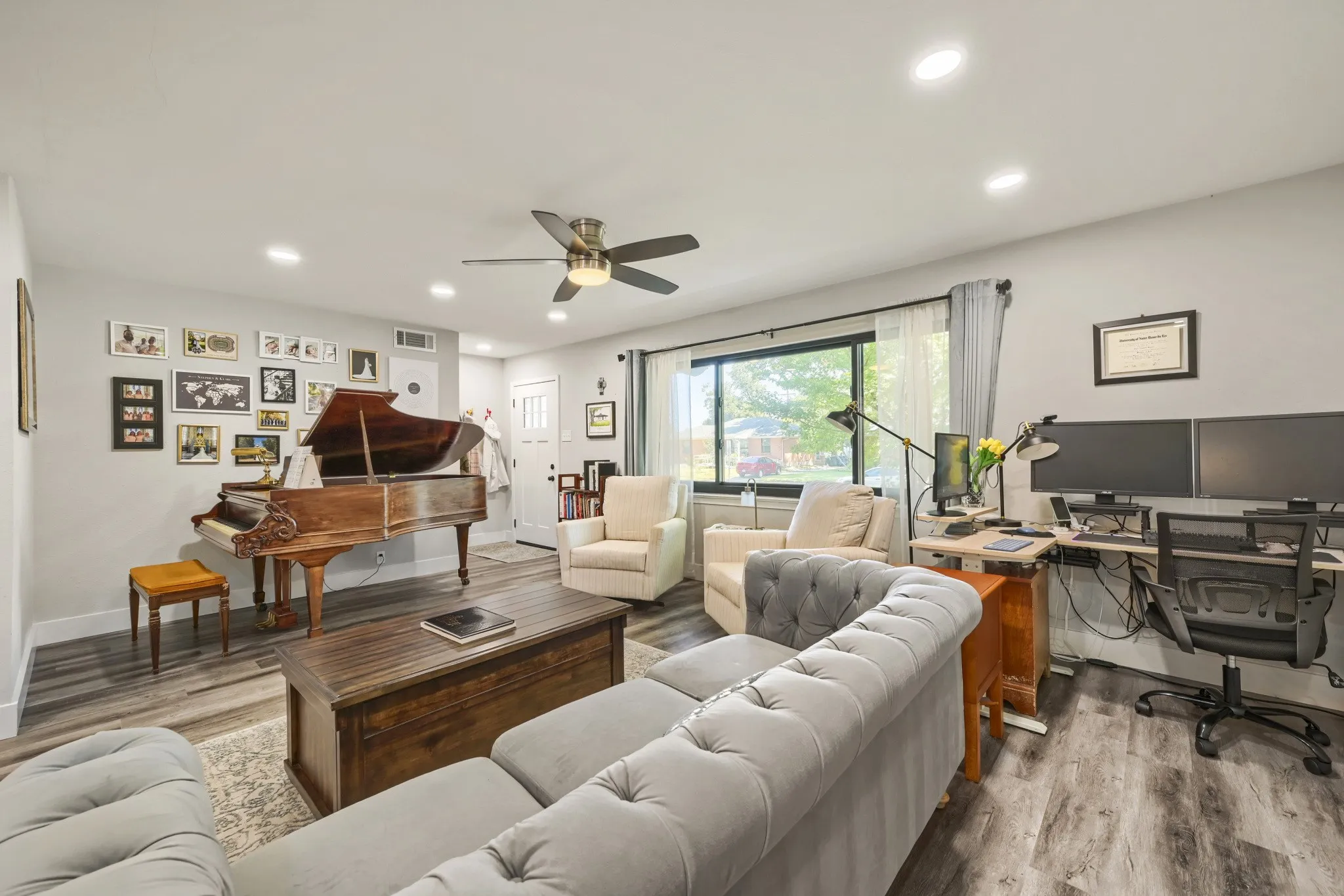 Recessed lighting throughout, wood-finish flooring, ceiling fan, and large windows