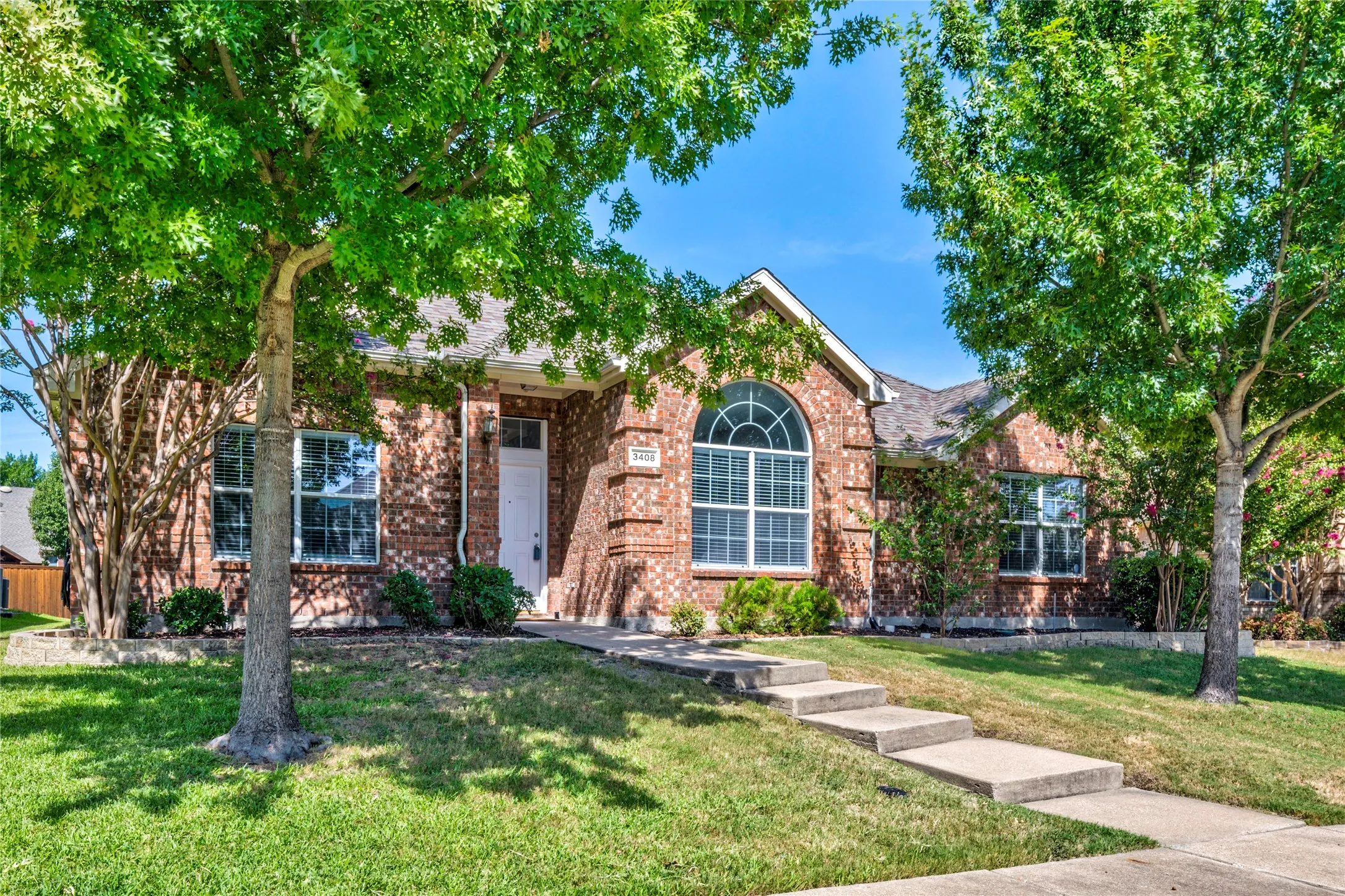 Mature trees and landscaping add to the beauty of this property.