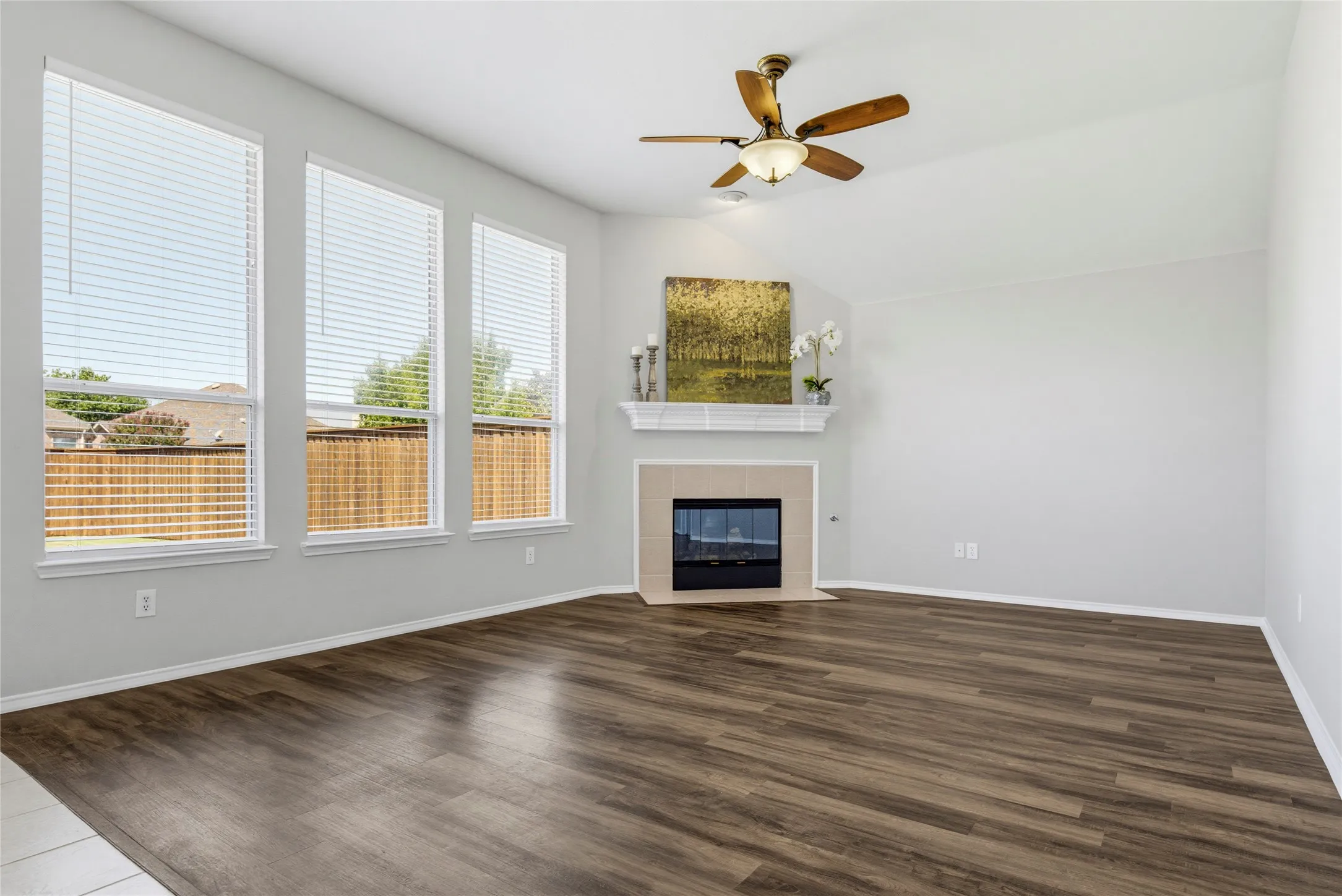 A corner fireplace creates a focal point for this family room.
