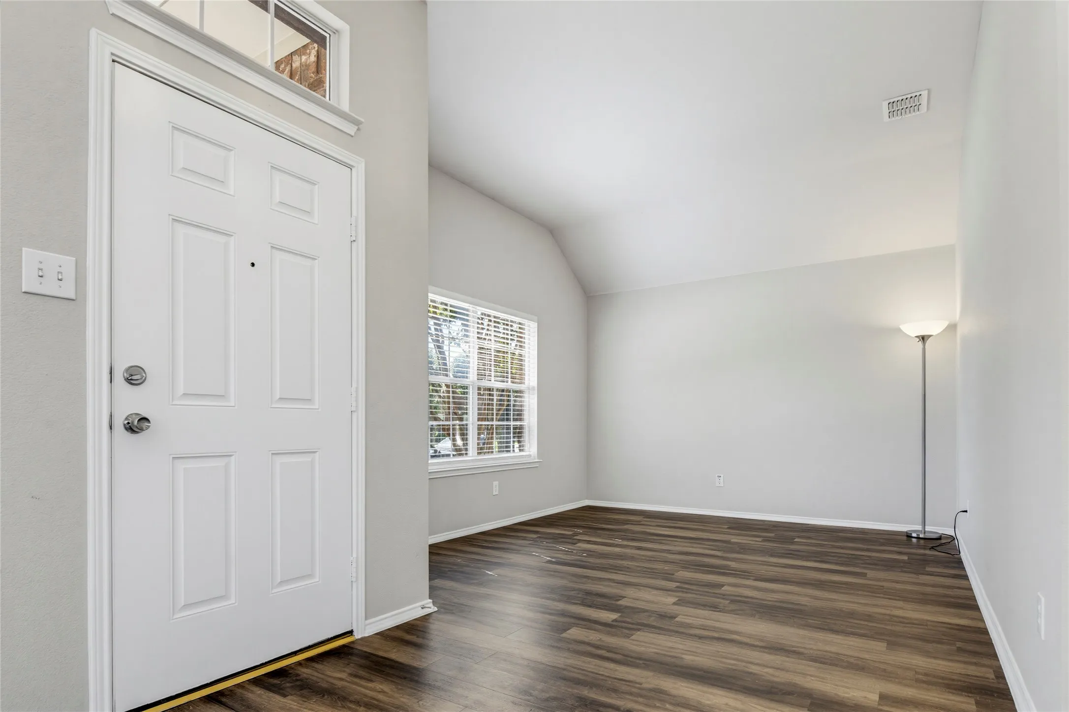 The formal living room is a great space to greet guests. French doors could easily be added to turn this space into a work-from-home office.