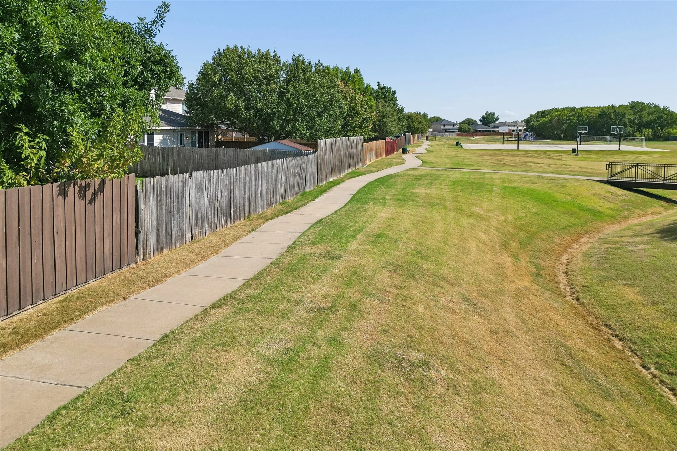 walking or biking  trail outside fence