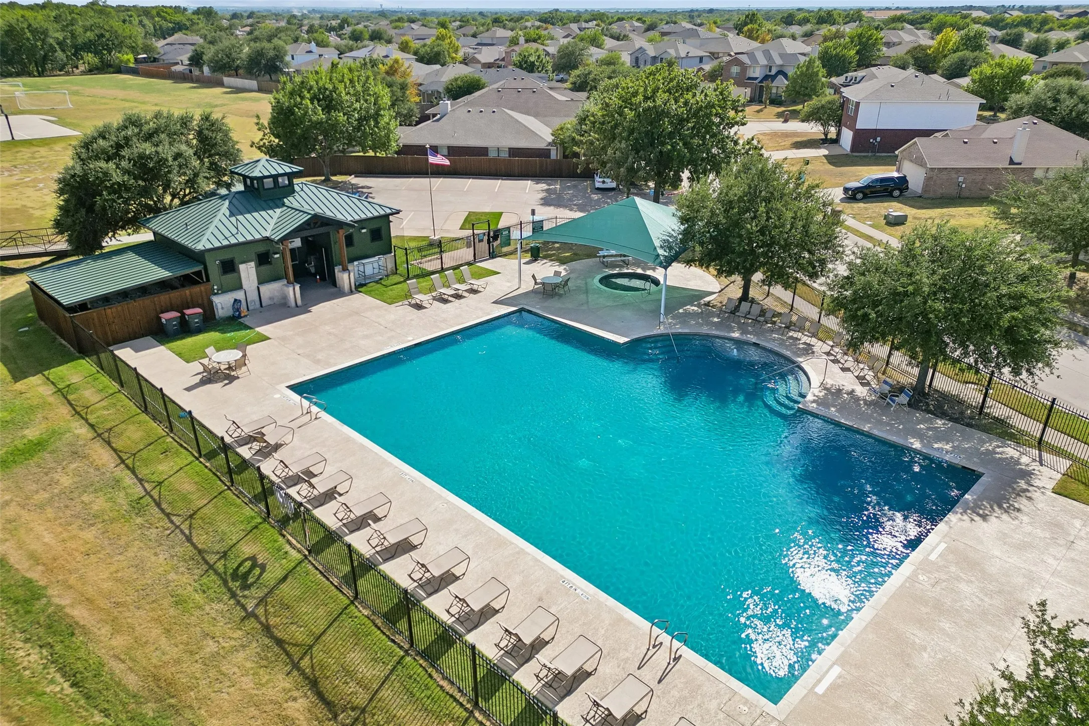 Community pool just outside the fence of the property