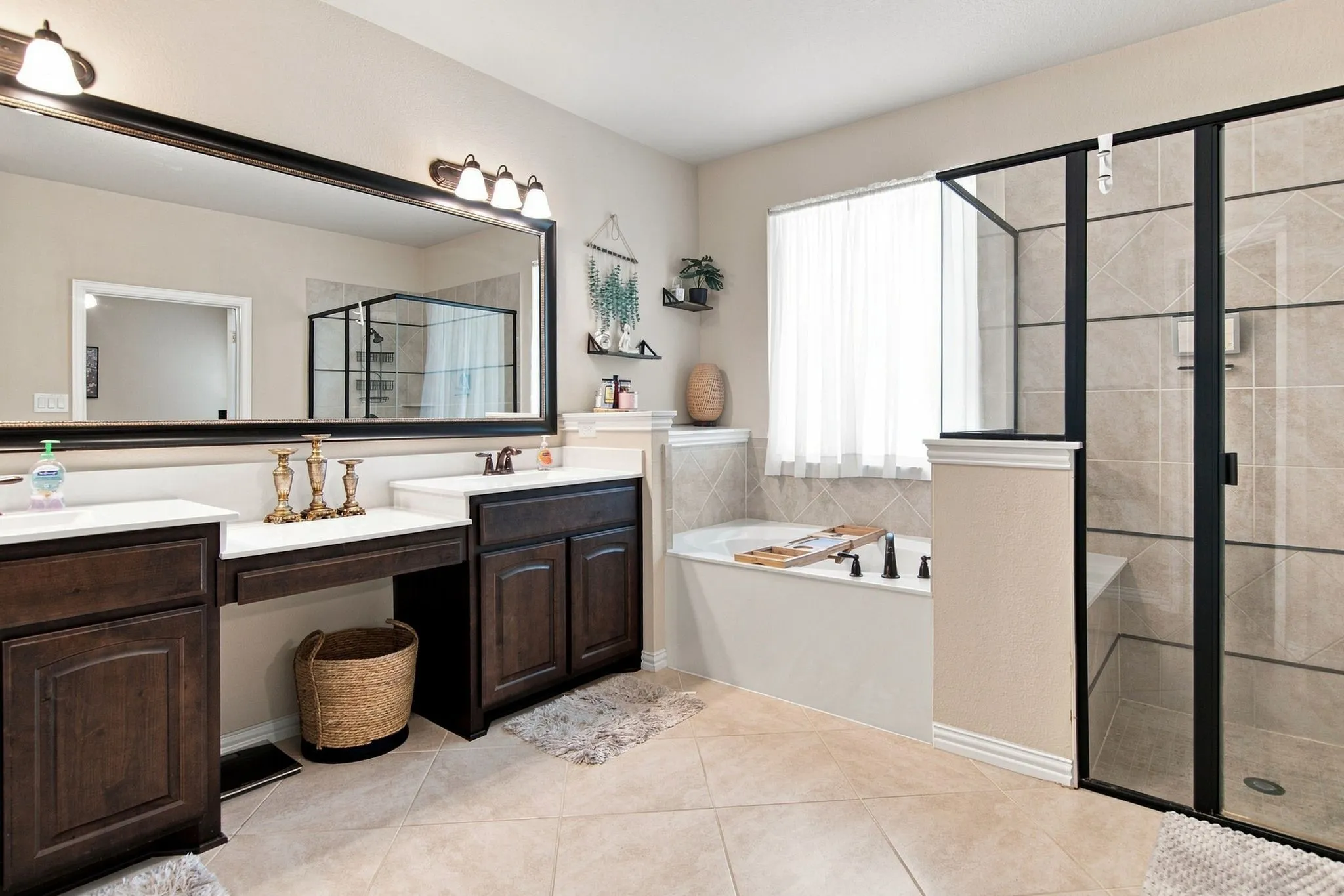Primary bath with dual vanity and separate shower and tub.  Come enjoy your spa time at the end of your day!