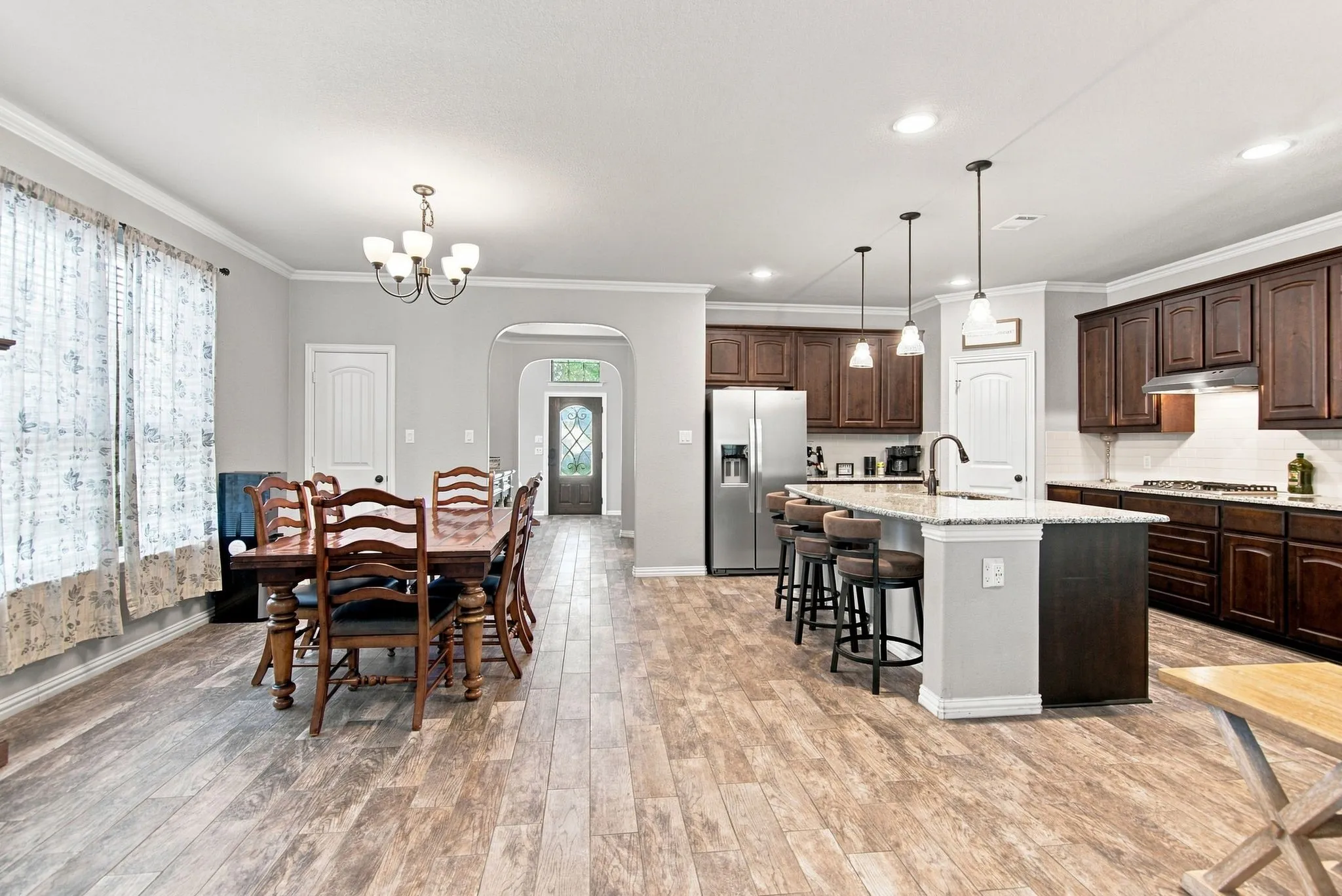 Open concept, very spacious and tons of cabinets, closet and pantry and counter top space.  The kitchen island is perfect for gathering around.