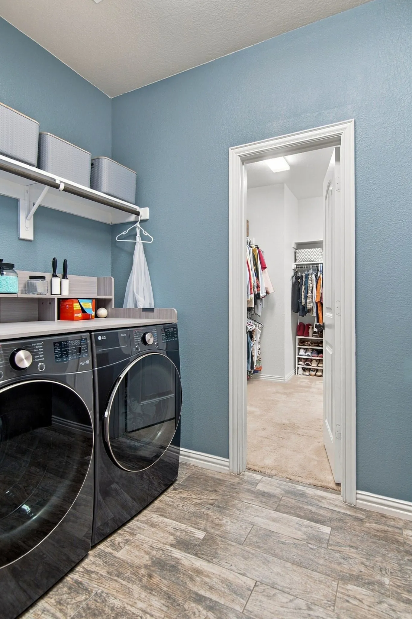 Your fabulous walk-through closet is adjacent to the laundry room...do you see that??  How amazing is this set up!!??