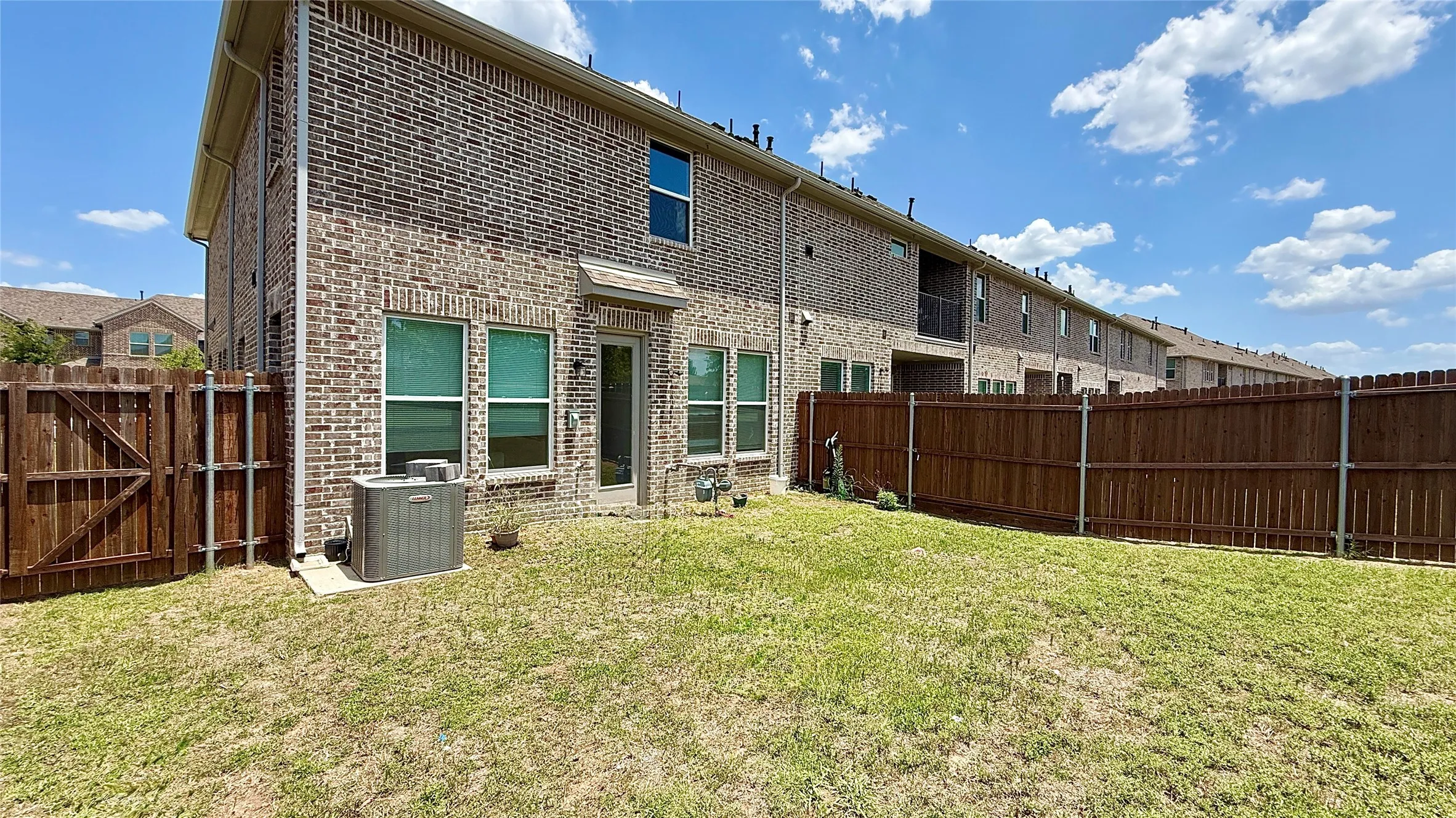 Expansive yard space featuring a full privacy fence