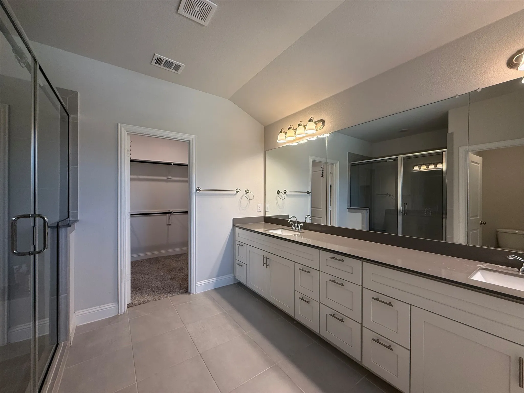 Expansive vanity with dual sinks and ample storage