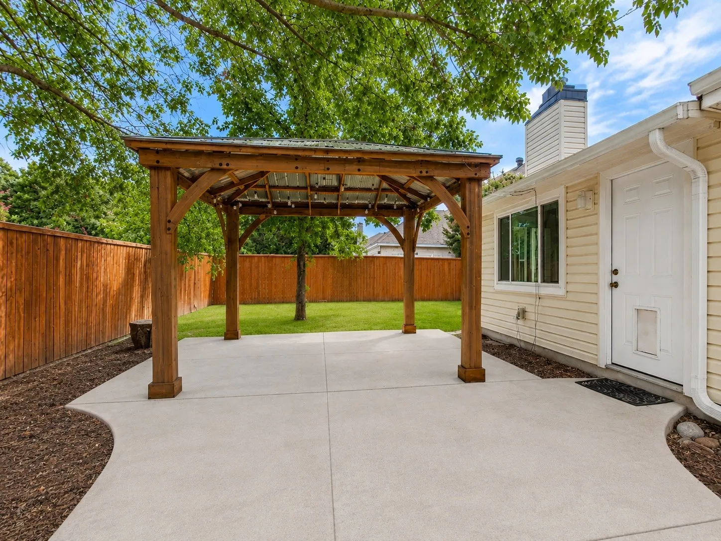 Open patio next to pergola