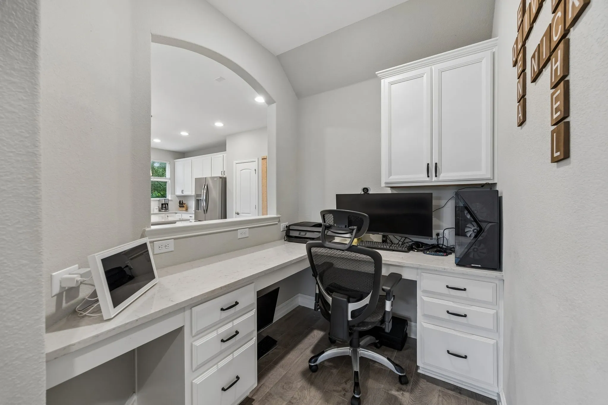A Pocket Office off the kitchen and Family room is a great place to keep the household organized
