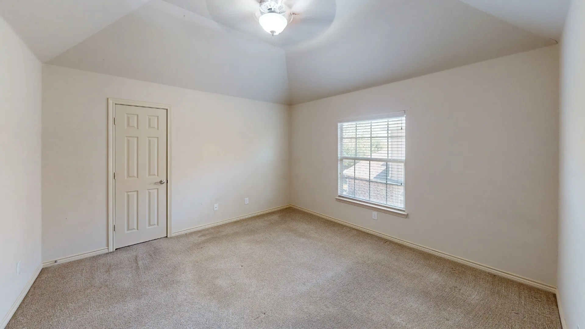 Vaulted ceiling with a flush-mount light fixture