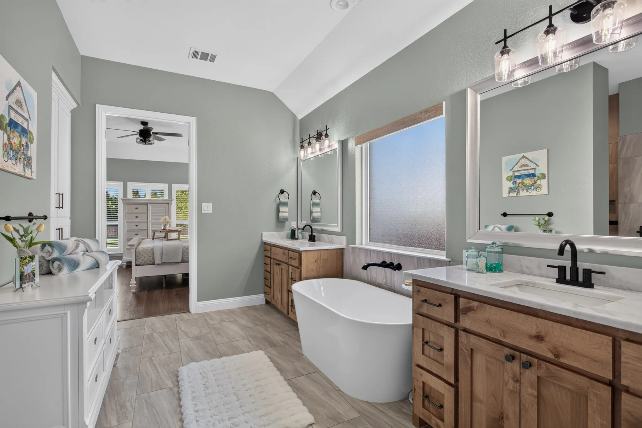 The primary suite offers shutters, a customized closet & elevated bath finishes with thoughtful details throughout that make everyday living feel effortless.