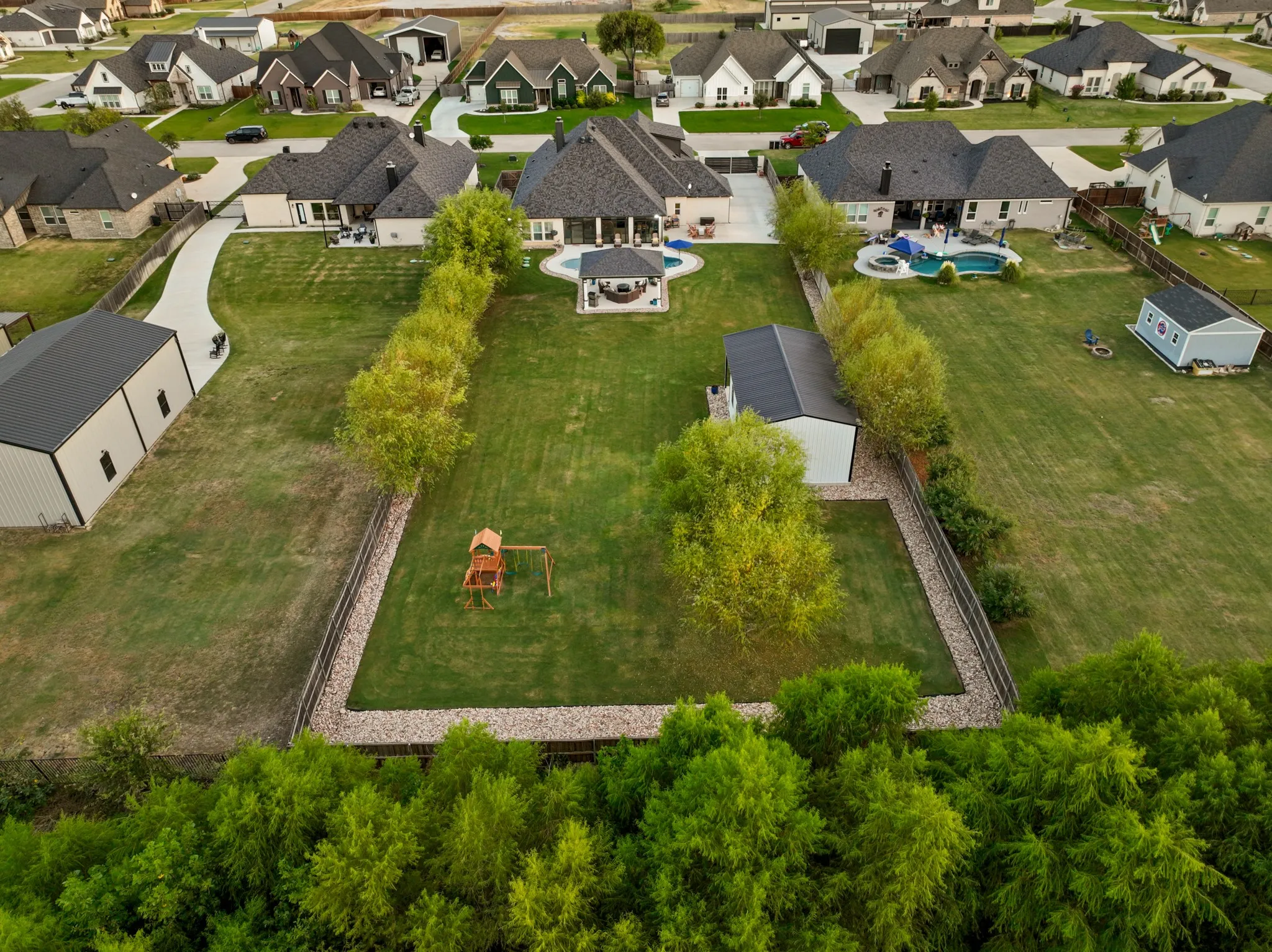 Privately positioned behind an electric gate & surrounded by the serenity of a pond & greenbelt with no rear neighbor, this extraordinary residence delivers a rare combination of privacy, scale, luxury customization & lifestyle.